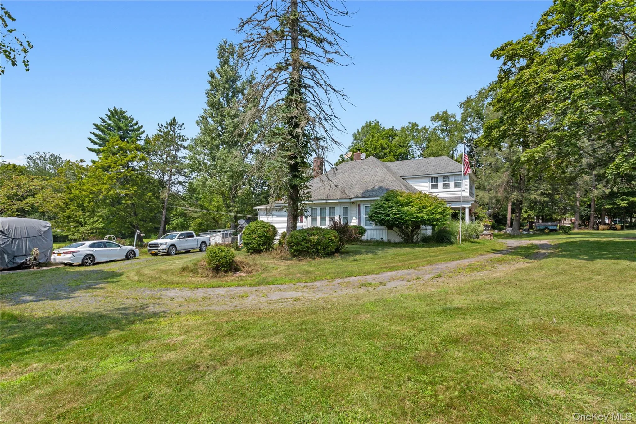View of home's exterior featuring a yard and a chimney View of home's exterior featuring a yard and a chimney