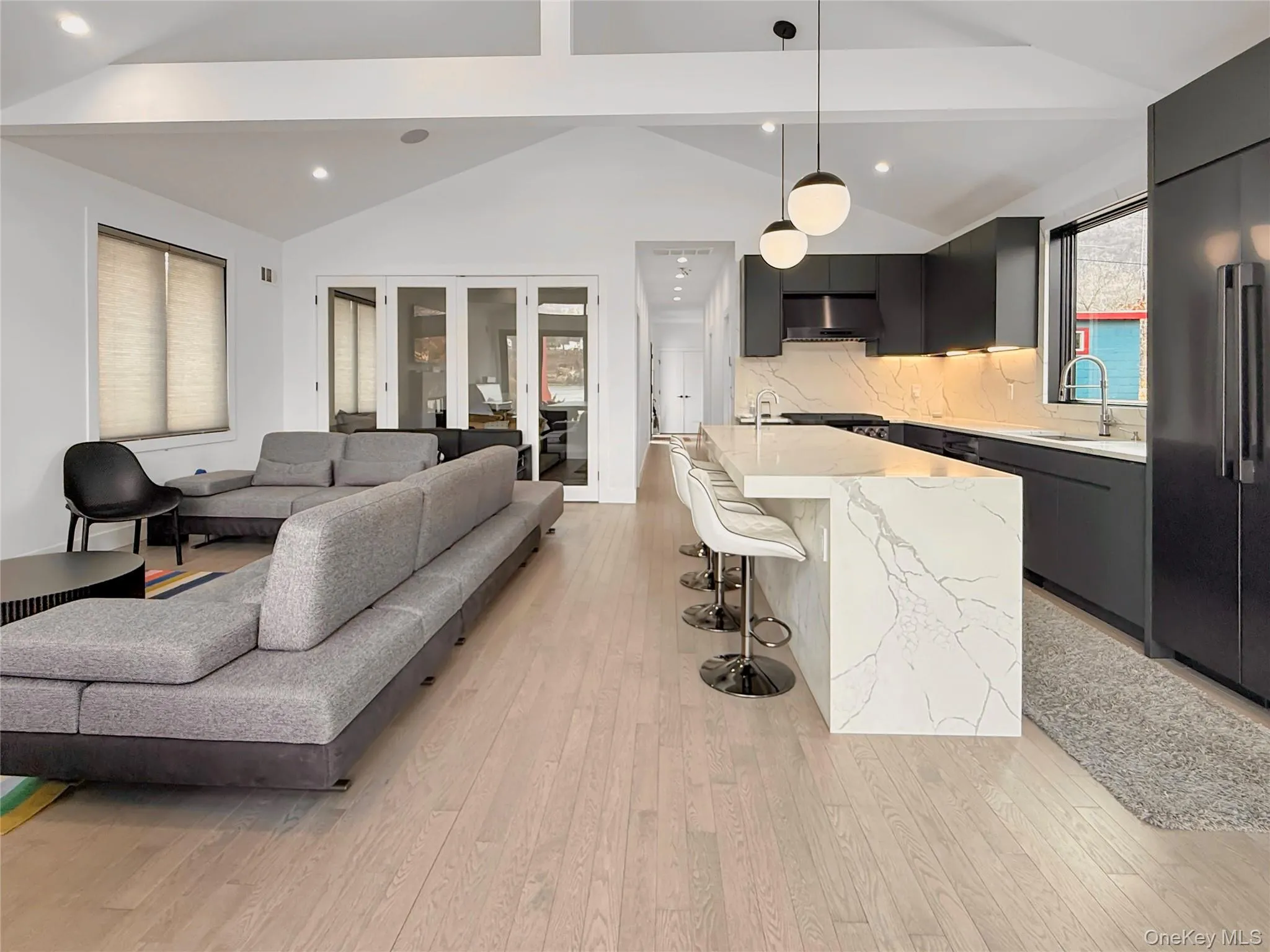 Sliding doors in main living space provide option for additional living space or bedroom Sliding doors in main living space provide option for additional living space or bedroom