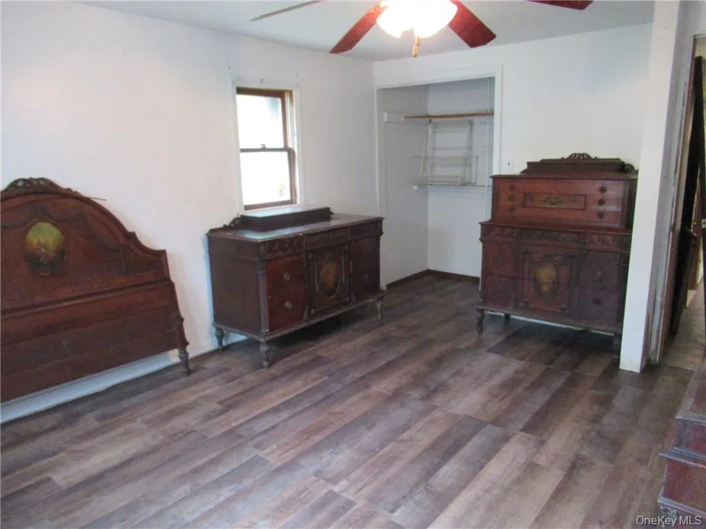 Bedroom featuring a closet, hardwood / wood-style flooring, and ceiling fan Bedroom featuring a closet, hardwood / wood-style flooring, and ceiling fan