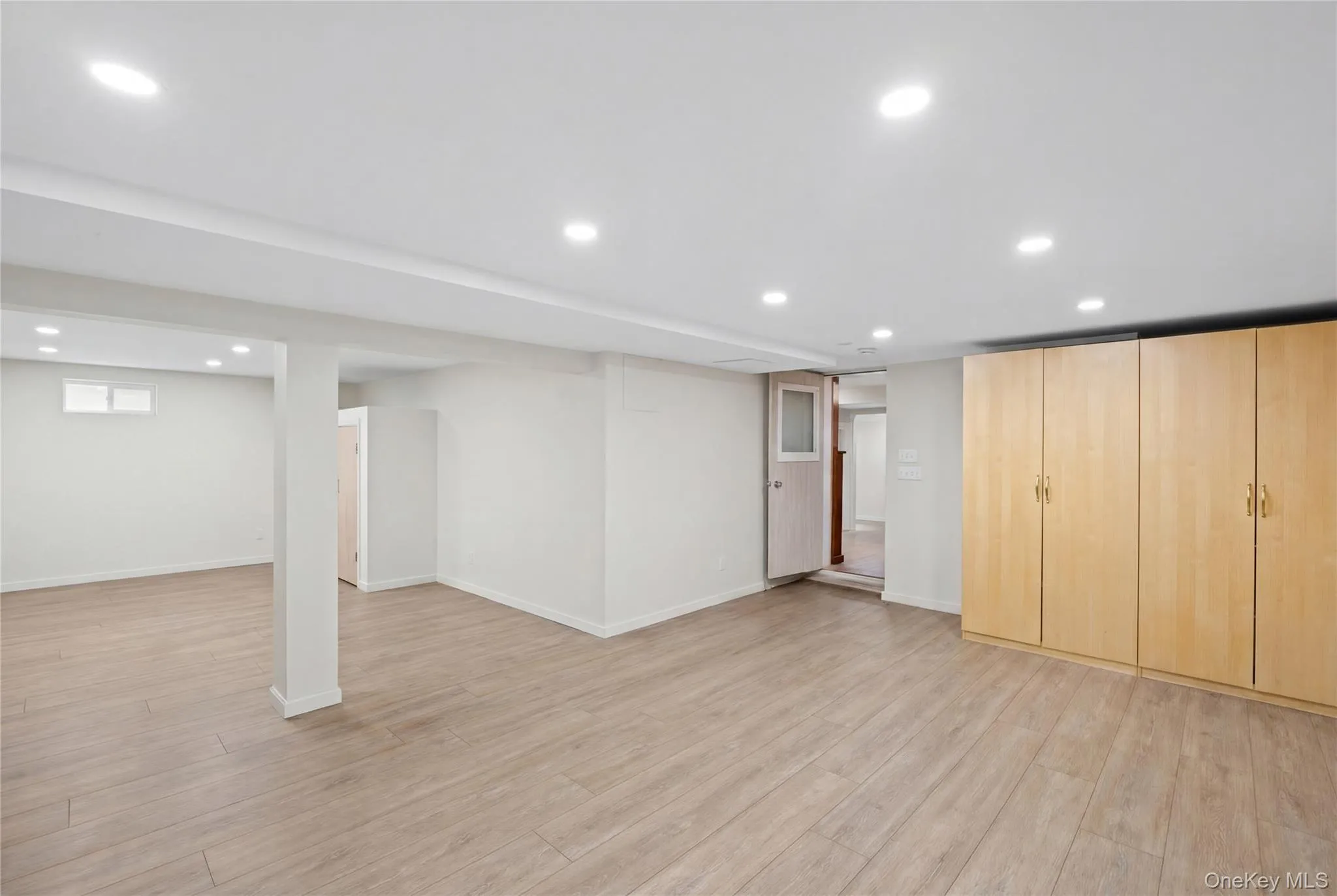 Expansive room featuring recessed lighting, light wood-look flooring. Expansive room featuring recessed lighting, light wood-look flooring.