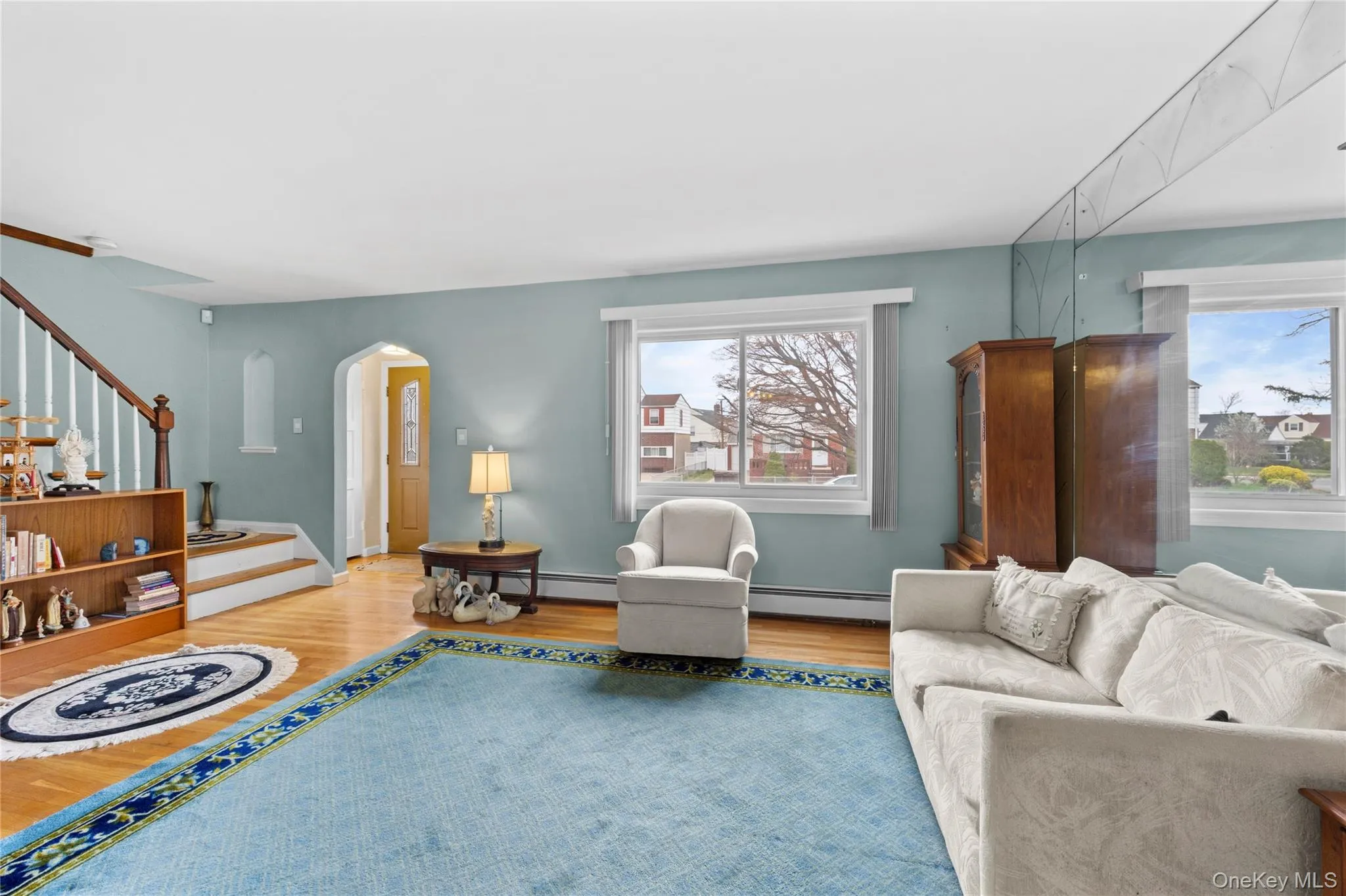 This inviting living area features hardwood floors and natural light . This inviting living area features hardwood floors and natural light .