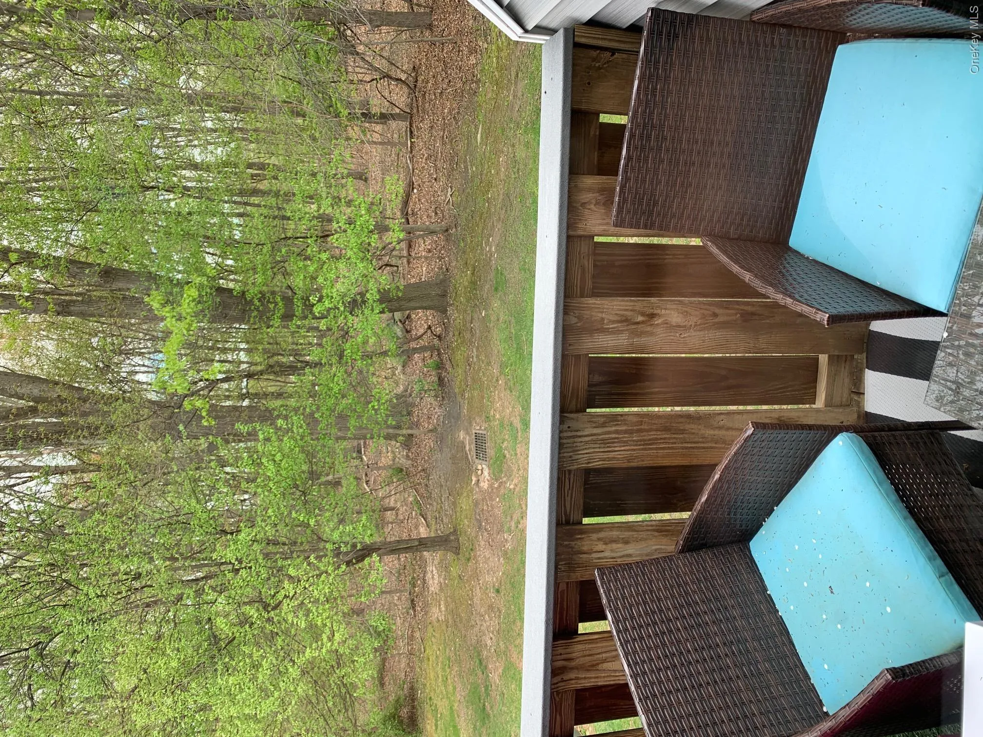 The private deck overlooks a grassy and wooded area The private deck overlooks a grassy and wooded area