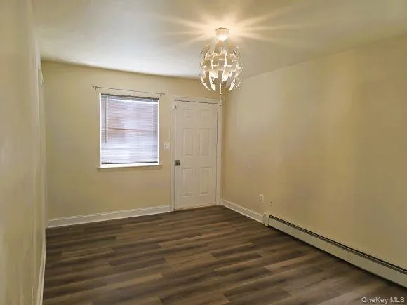 Master bedroom features wood-look LVP flooring, a window with blinds, master bathroom, closets and direct access to rear patio. Master bedroom features wood-look LVP flooring, a window with blinds, master bathroom, closets and direct access to rear patio.