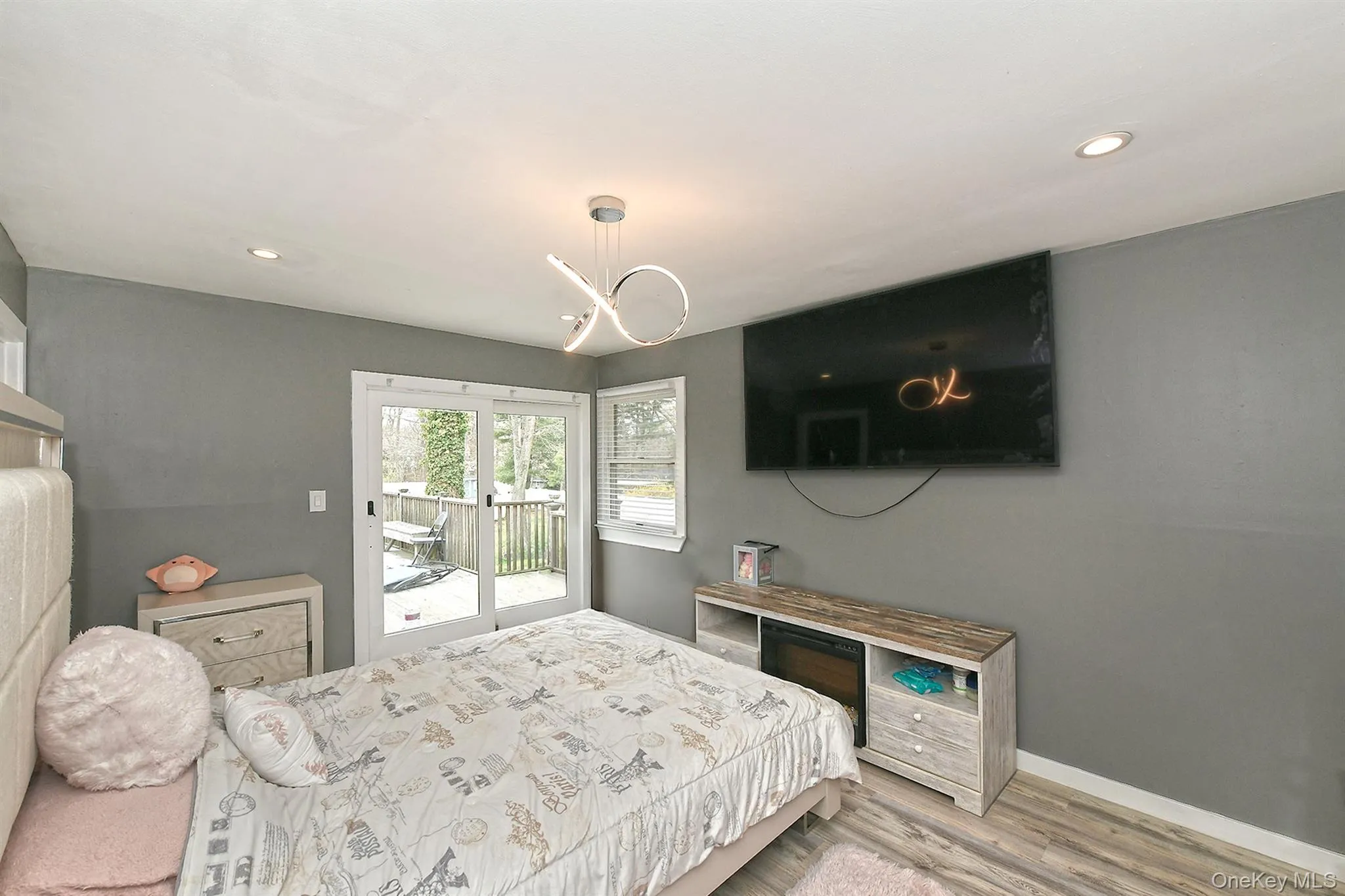 Primary Bedroom with private access to large deck. Primary Bedroom with private access to large deck.