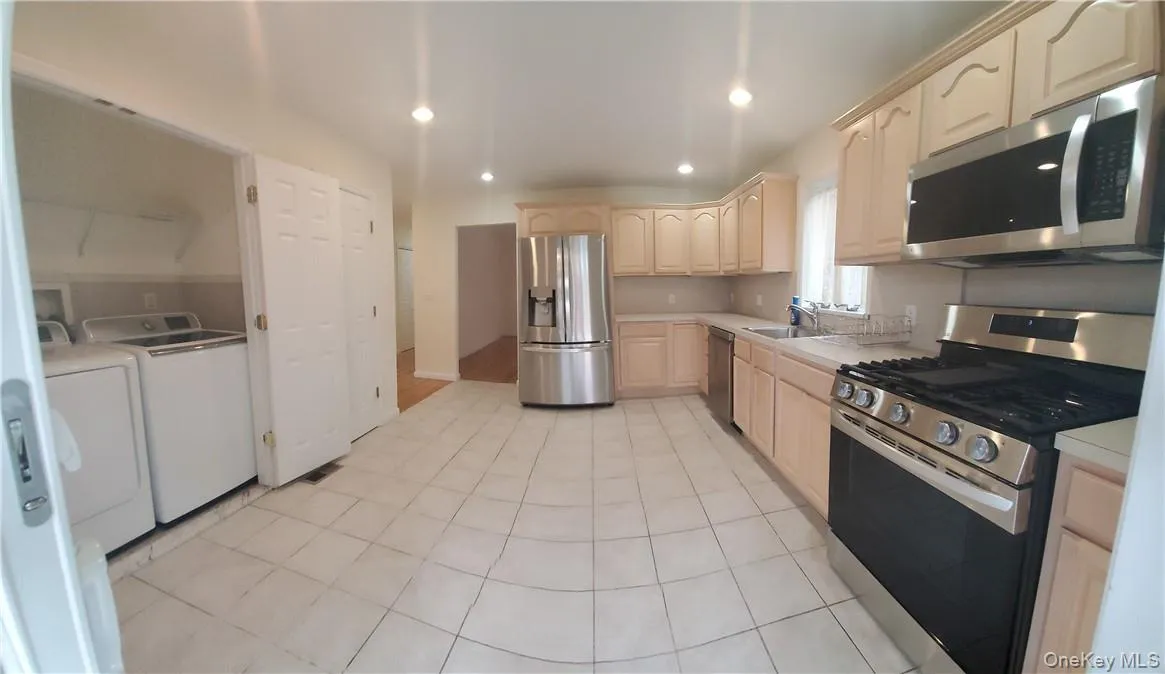 Large Eat-In Kitchen with new remote control stainless steel appliances. Large Eat-In Kitchen with new remote control stainless steel appliances.