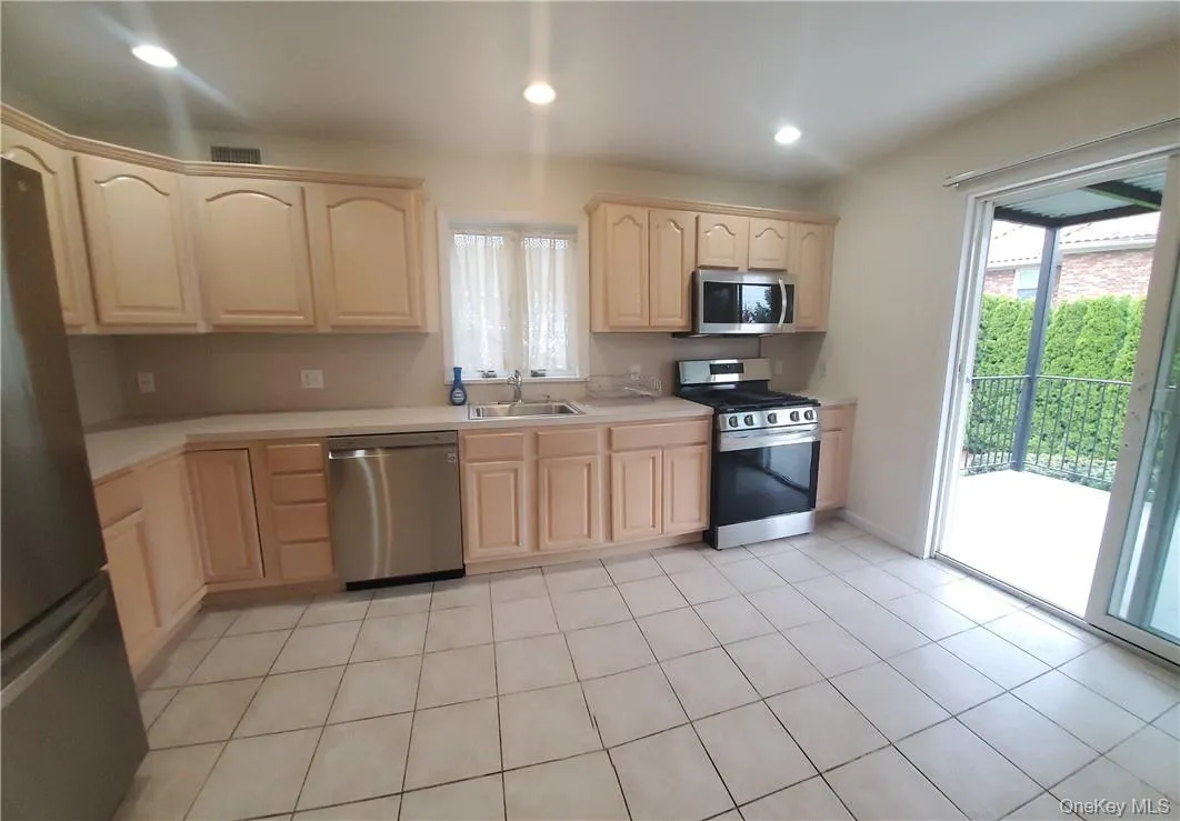 Easy Access to the Deck from the large kitchen. Easy Access to the Deck from the large kitchen.