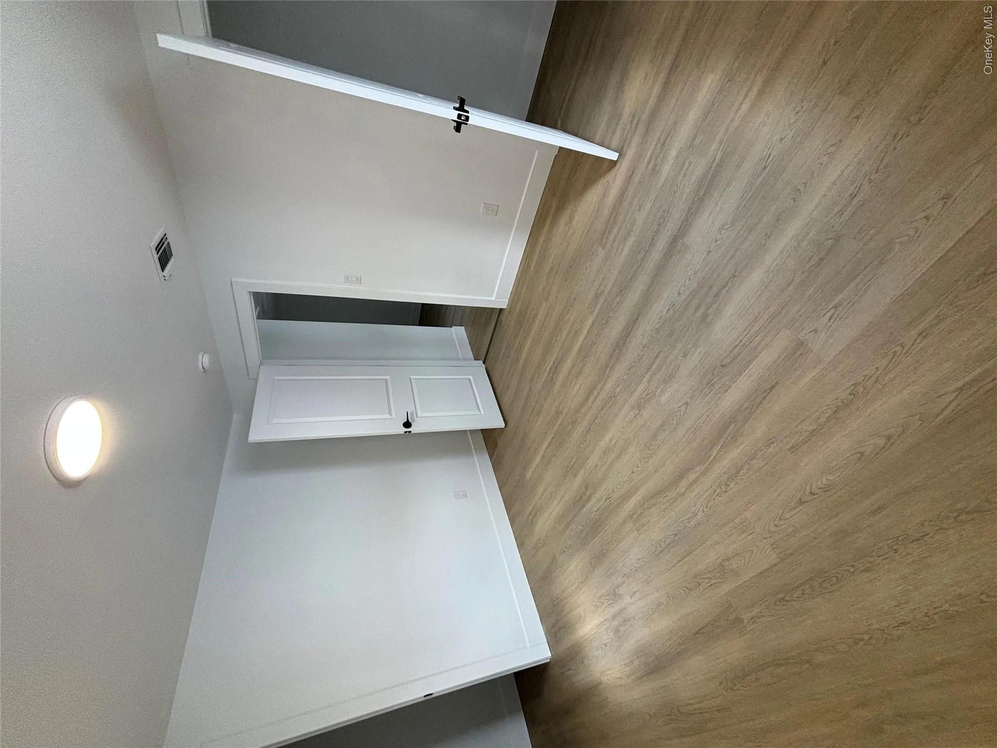 Unfurnished bedroom featuring baseboards and light wood-style flooring Unfurnished bedroom featuring baseboards and light wood-style flooring