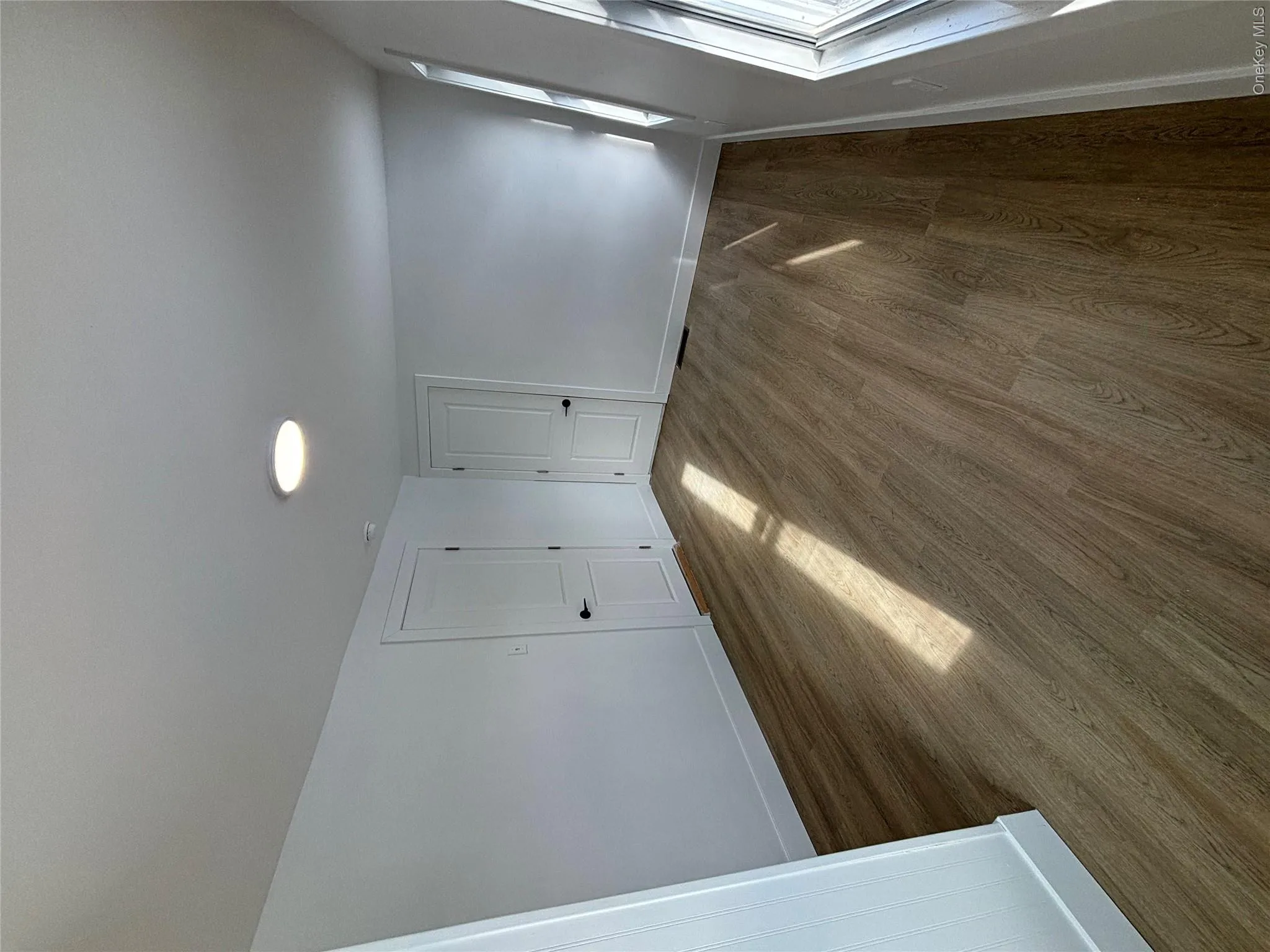 Unfurnished bedroom with baseboards and wood finished floors Unfurnished bedroom with baseboards and wood finished floors