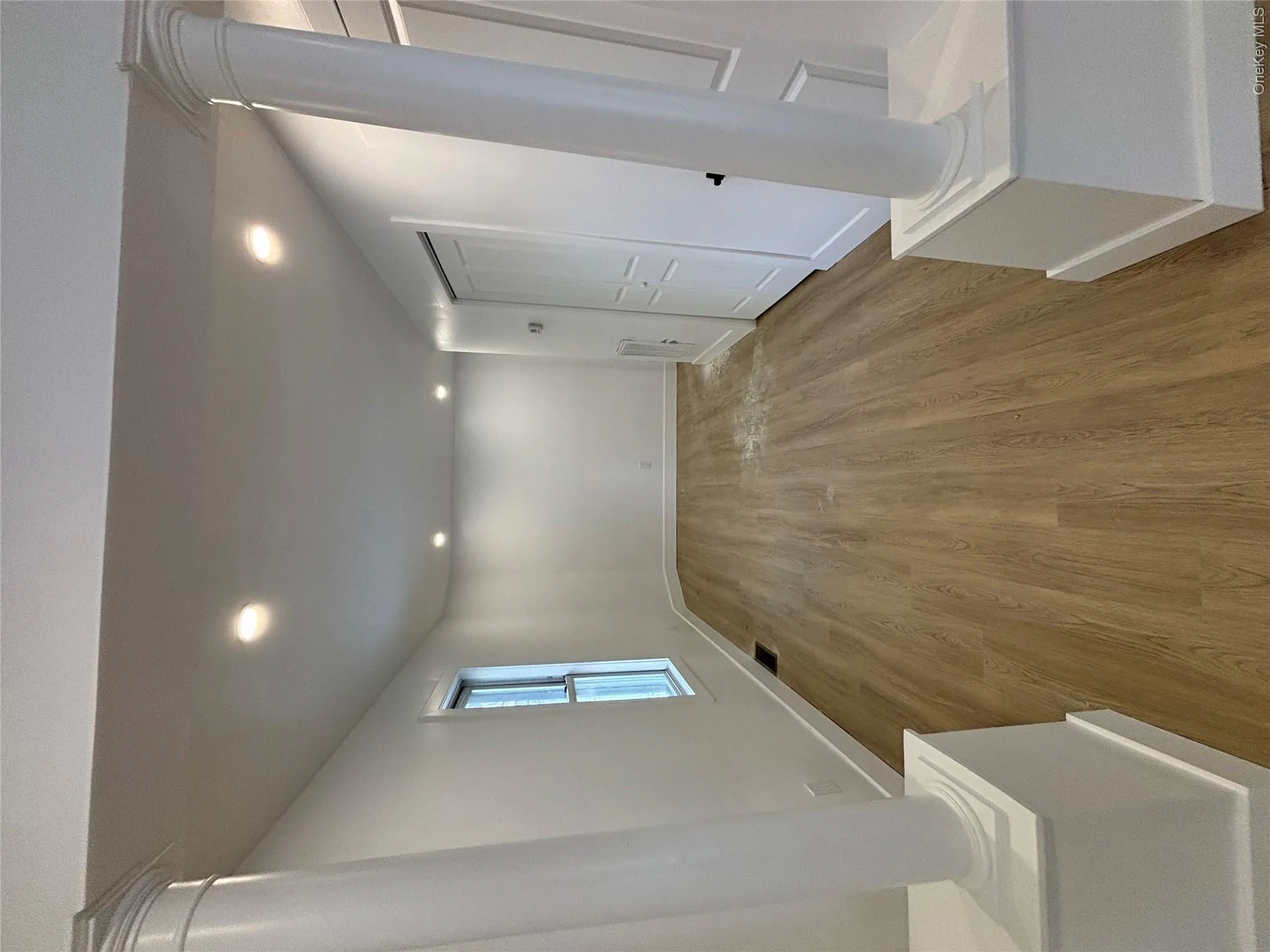 Basement featuring recessed lighting and wood finished floors Basement featuring recessed lighting and wood finished floors