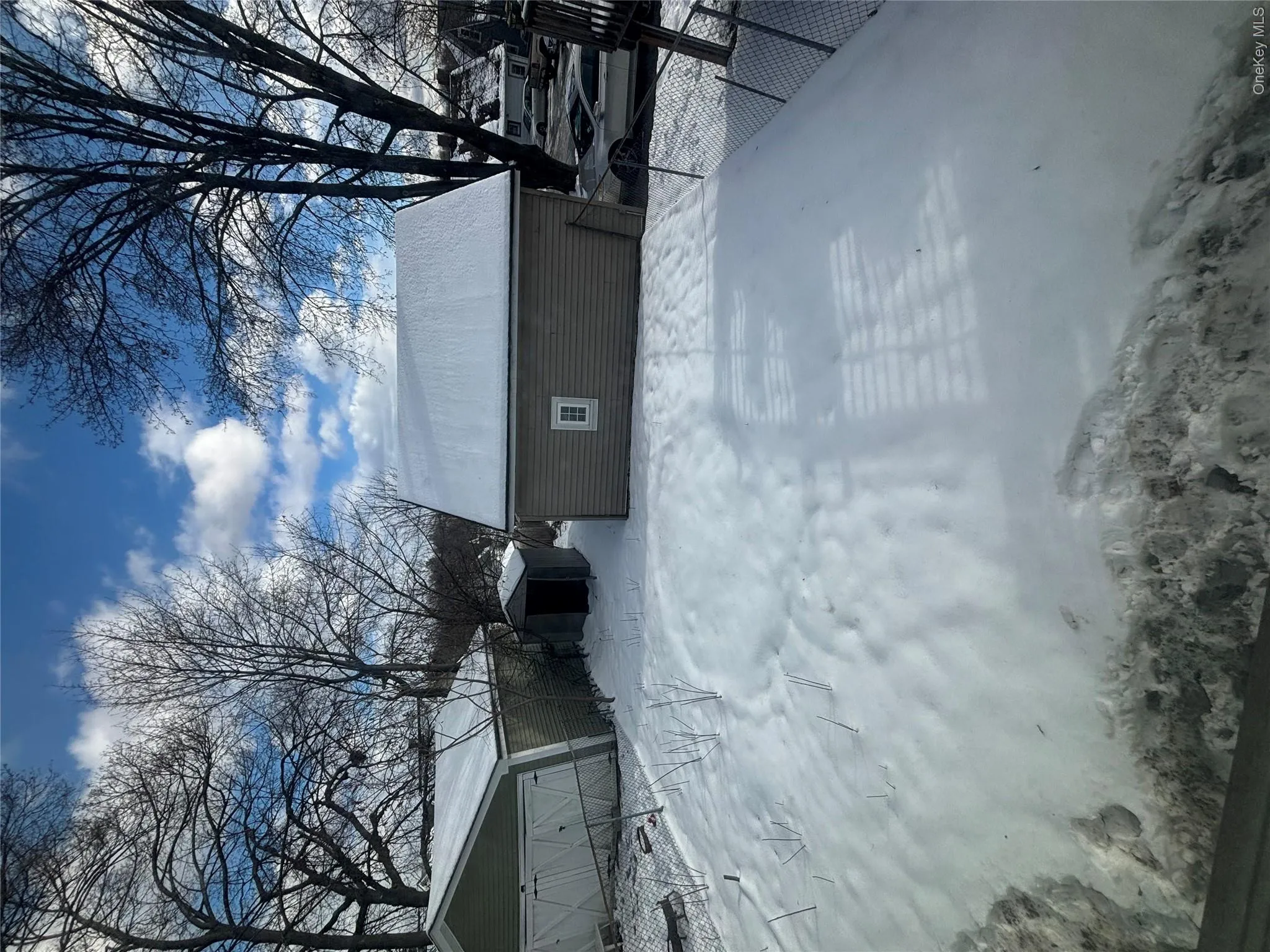 View of snowy exterior featuring an outdoor structure View of snowy exterior featuring an outdoor structure