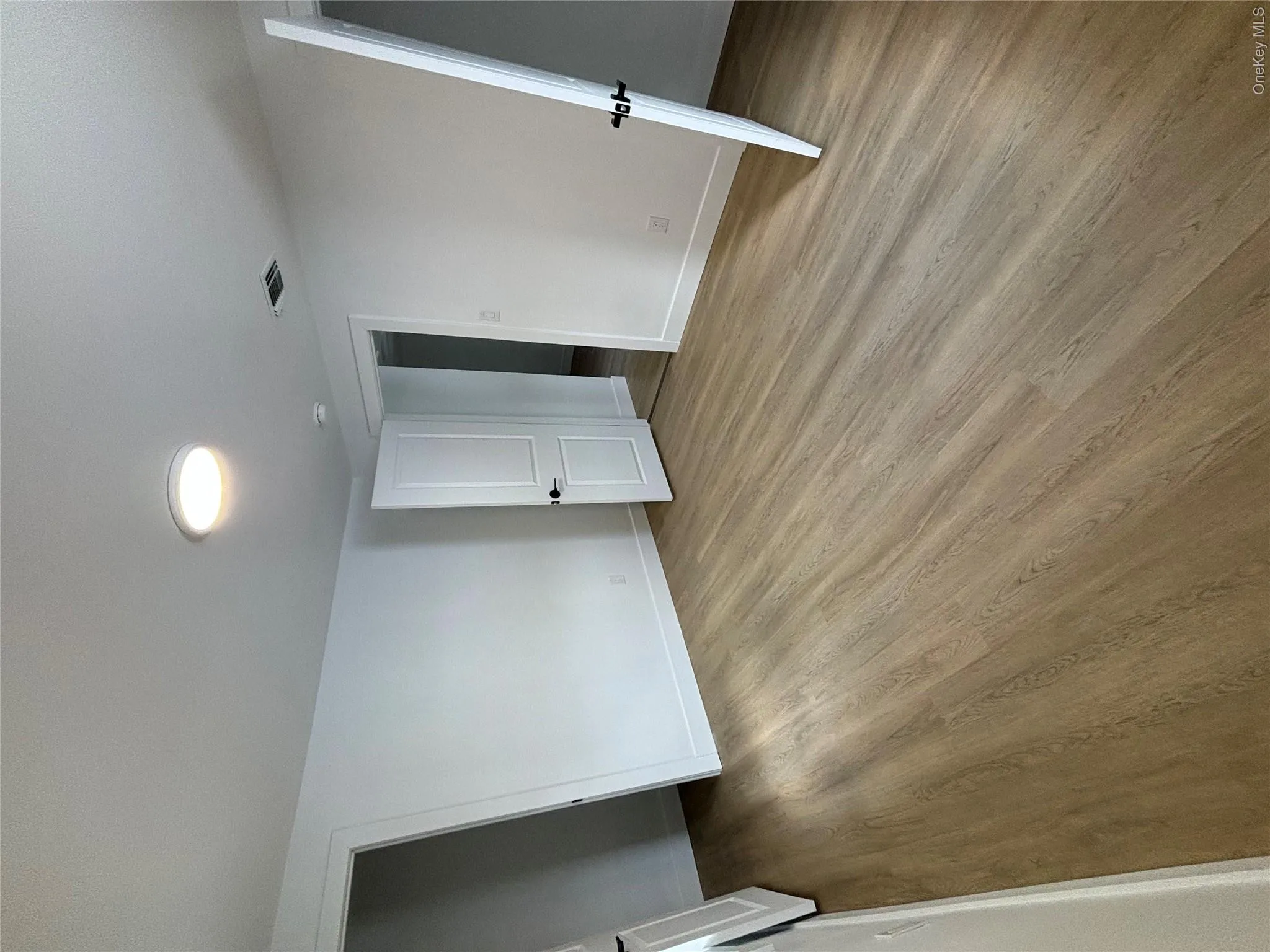 Unfurnished bedroom with light wood-type flooring and baseboards Unfurnished bedroom with light wood-type flooring and baseboards