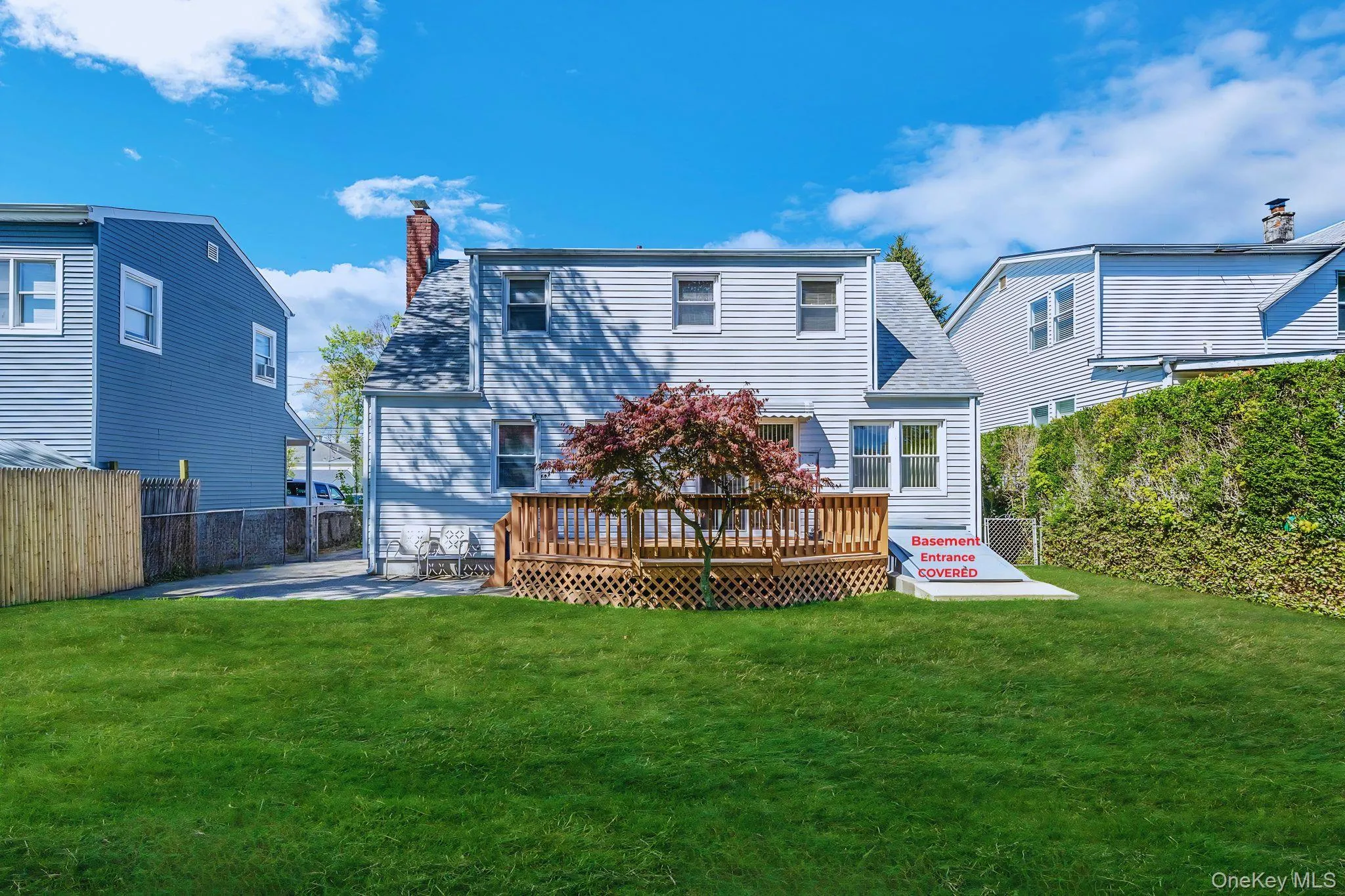 Backyard with Deck and outside basement enclosed access Backyard with Deck and outside basement enclosed access