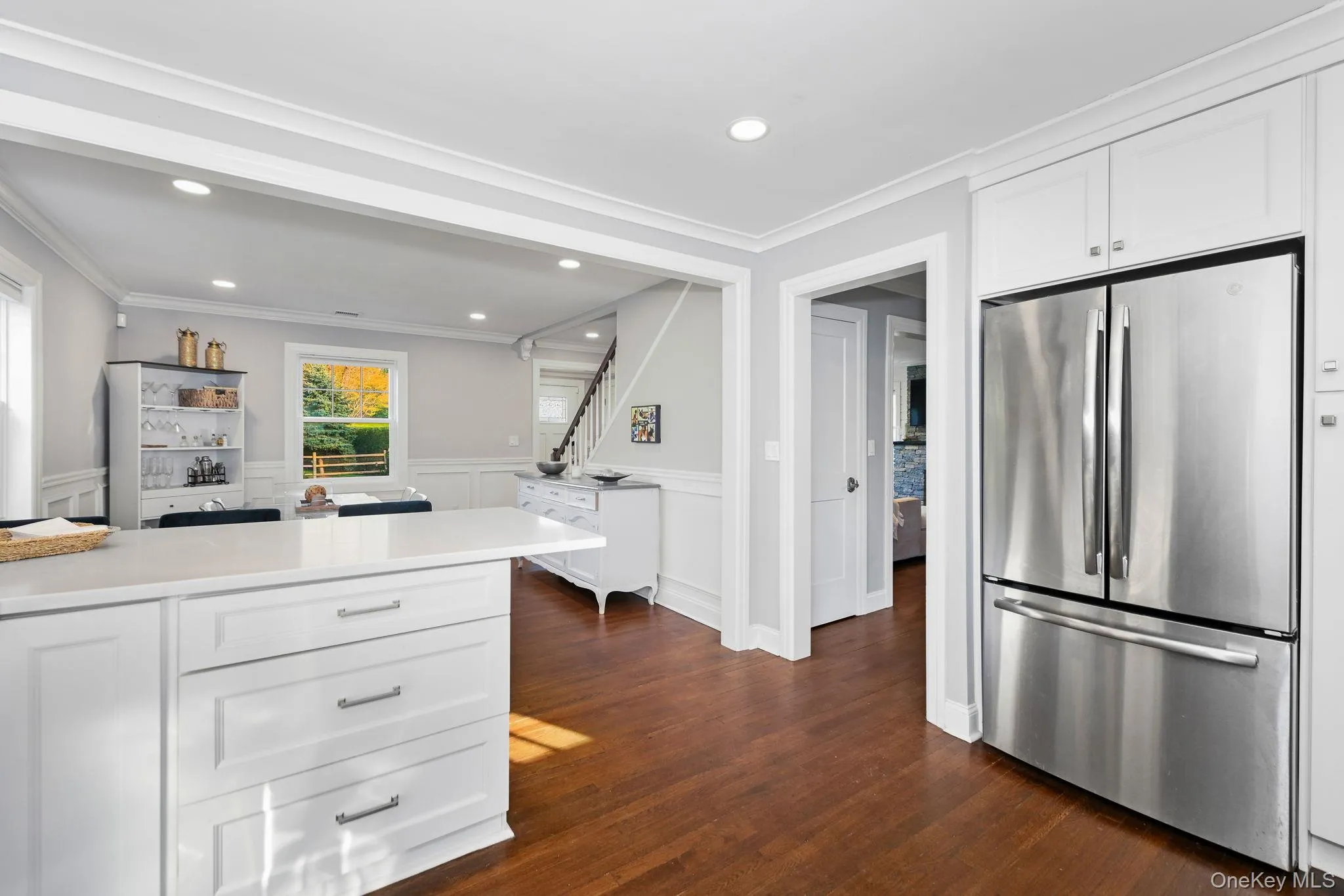 Just off the kitchen, a well-placed formal powder room and an additional closet offer both convenience and functionality. Just off the kitchen, a well-placed formal powder room and an additional closet offer both convenience and functionality.