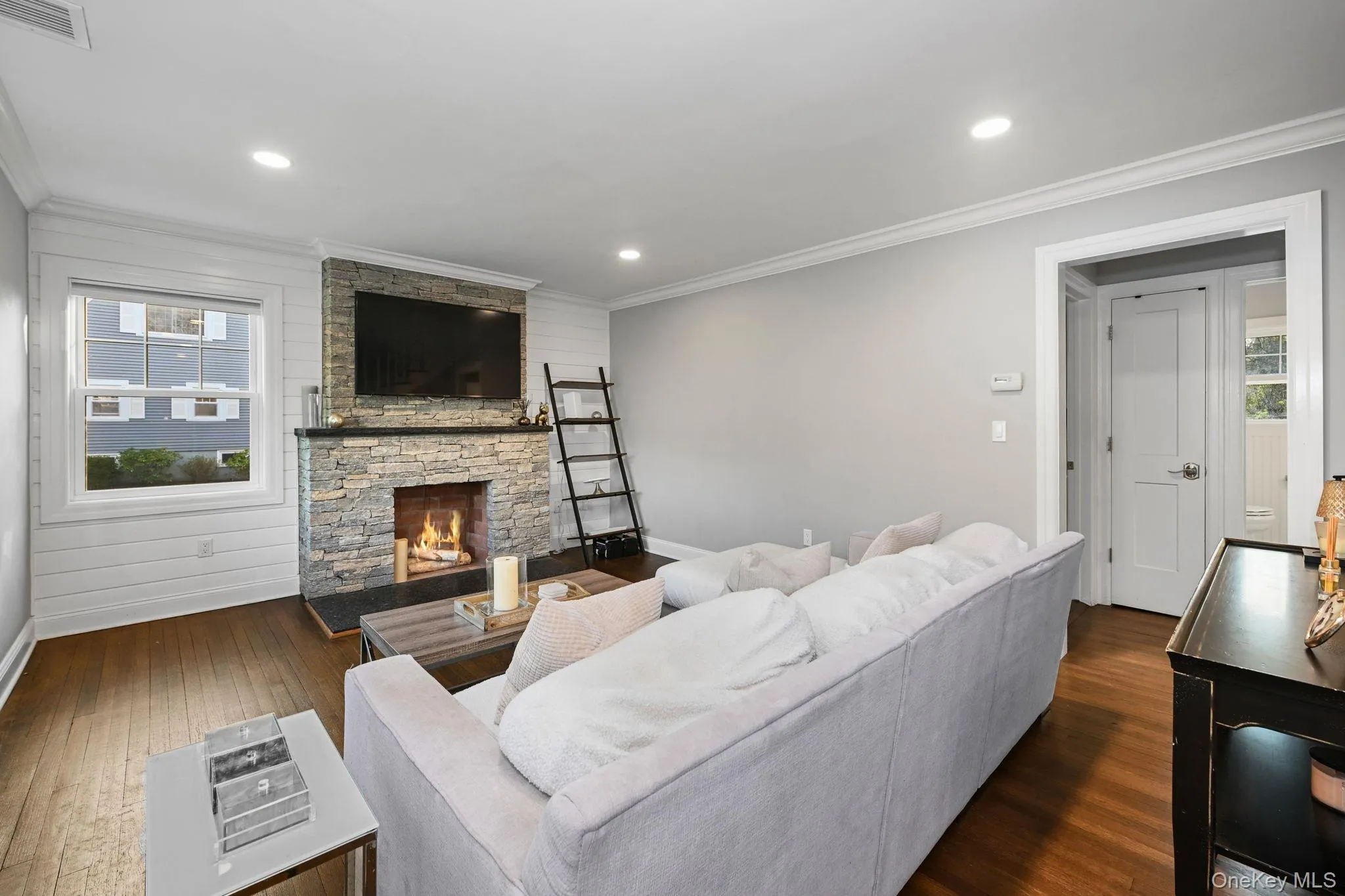 Anchored by a stone, wood-burning fireplace, the living room is warm, inviting, and effortlessly comfortable. Anchored by a stone, wood-burning fireplace, the living room is warm, inviting, and effortlessly comfortable.