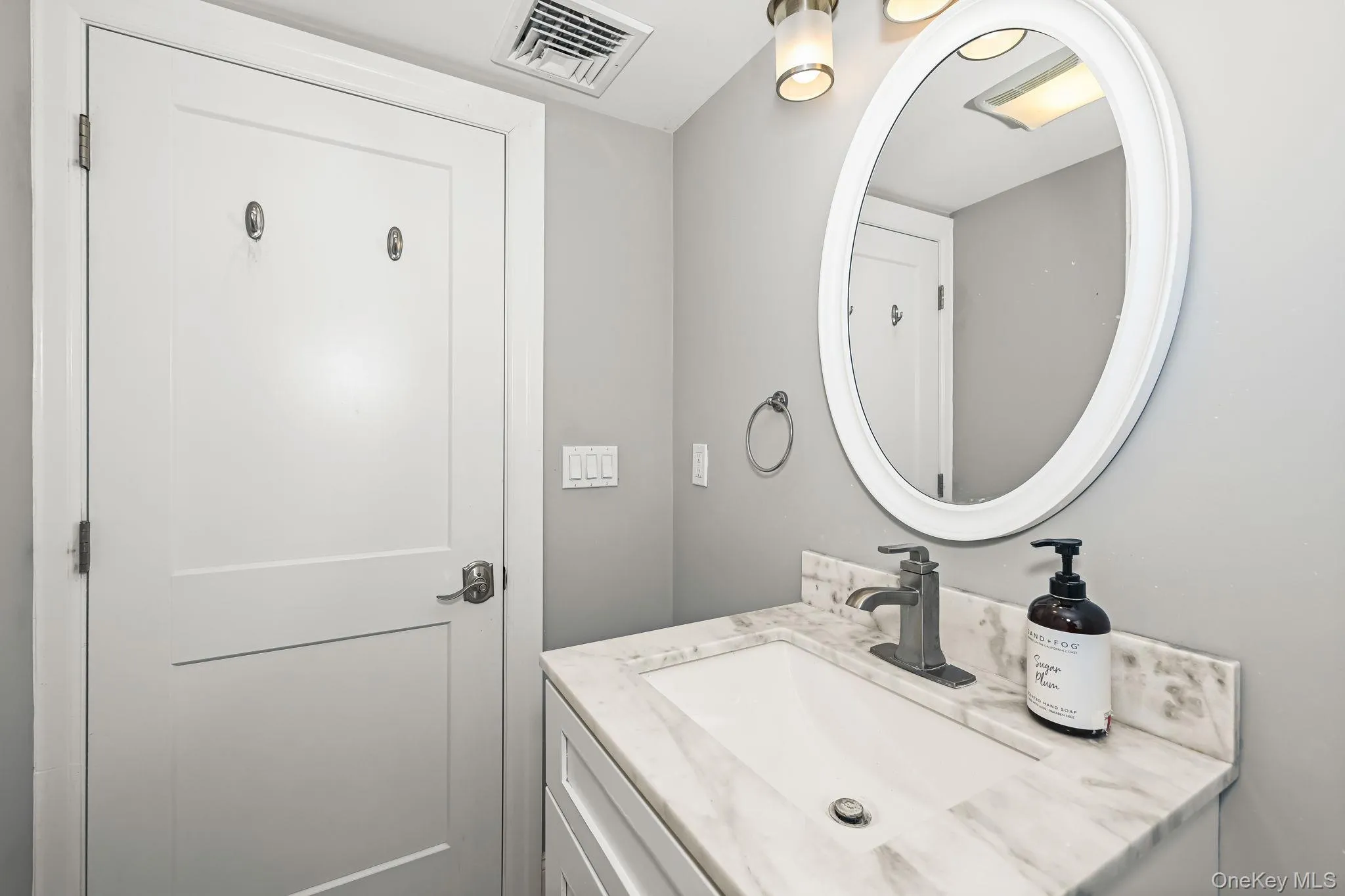 Custom vanity with decorative lighting and mirror. Custom vanity with decorative lighting and mirror.