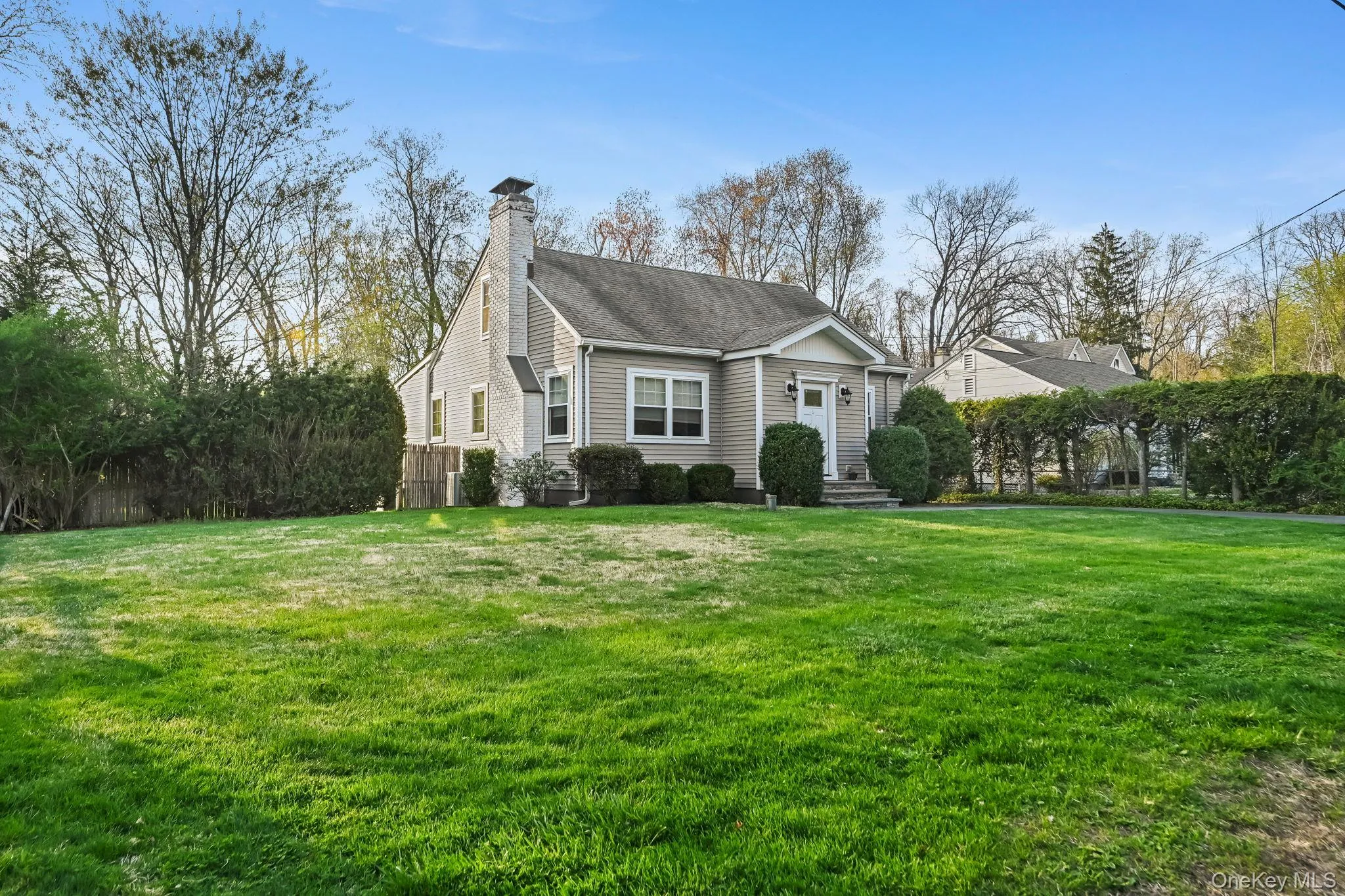 Set back from the road for added privacy, this home features a serene yard and a detached two-car garage. Set back from the road for added privacy, this home features a serene yard and a detached two-car garage.