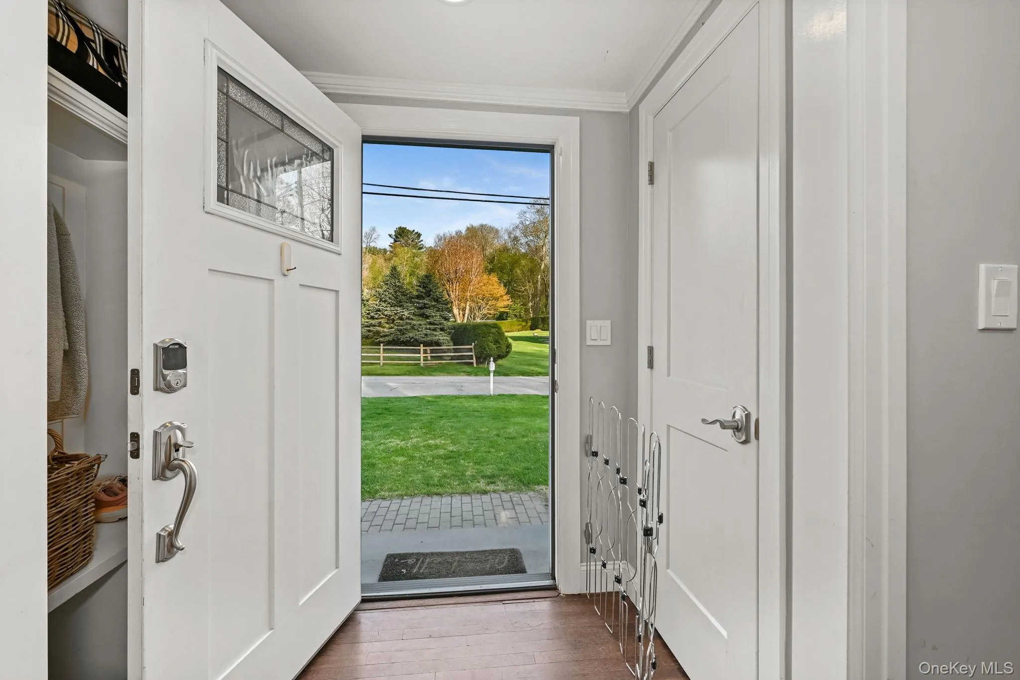 A welcoming entry foyer features a custom built-in bench and coat closet, designed for everyday ease and convenience. A welcoming entry foyer features a custom built-in bench and coat closet, designed for everyday ease and convenience.