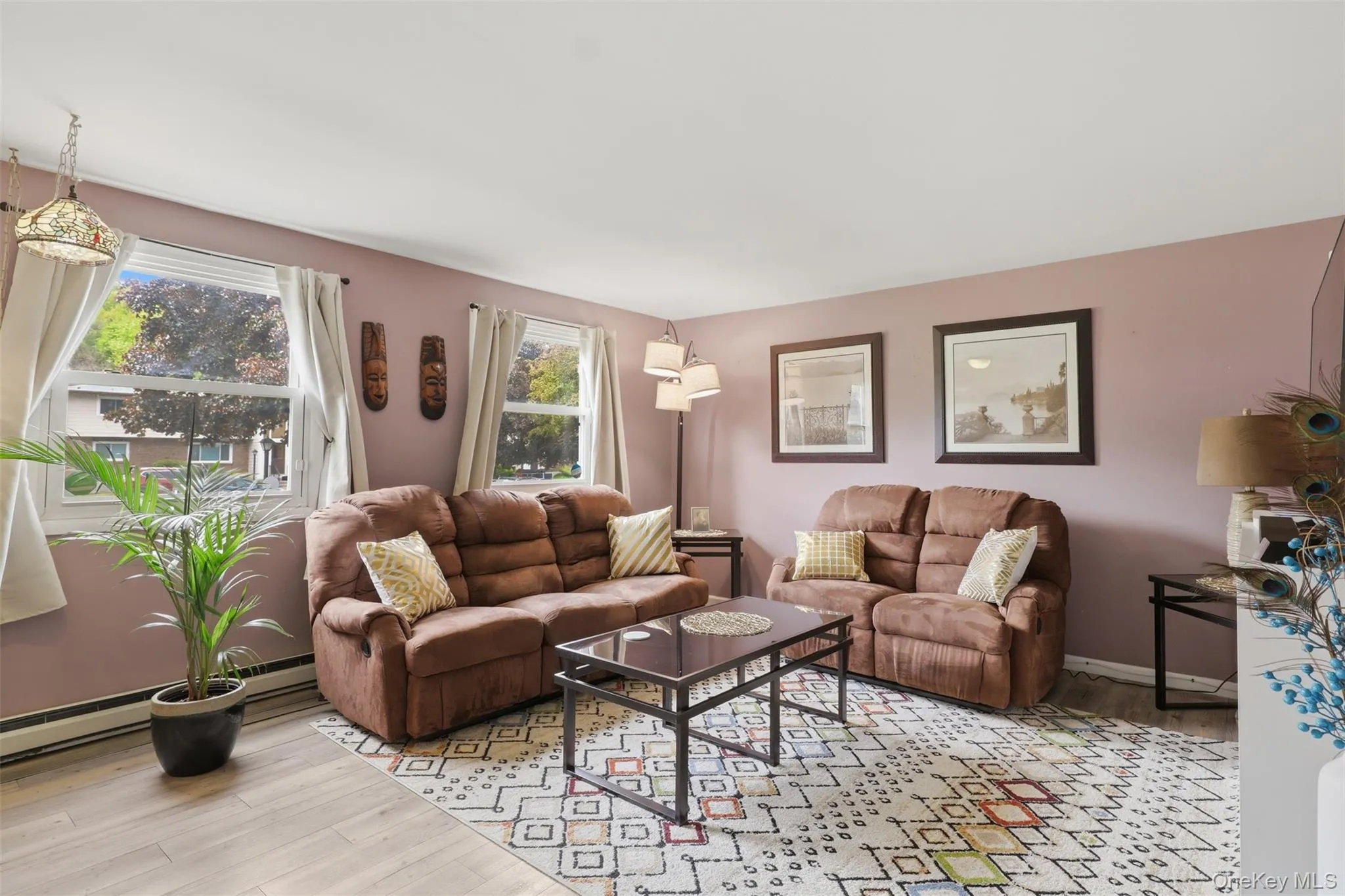 Living area featuring multiple windows allowing for natural light Living area featuring multiple windows allowing for natural light