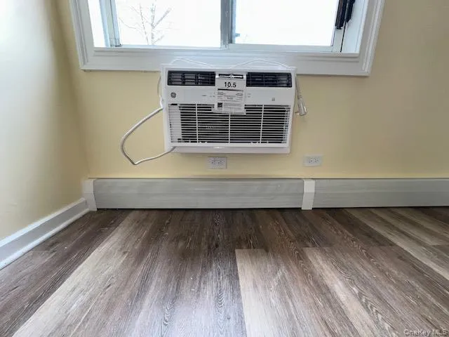 Room details featuring wood finished floors and baseboards Room details featuring wood finished floors and baseboards