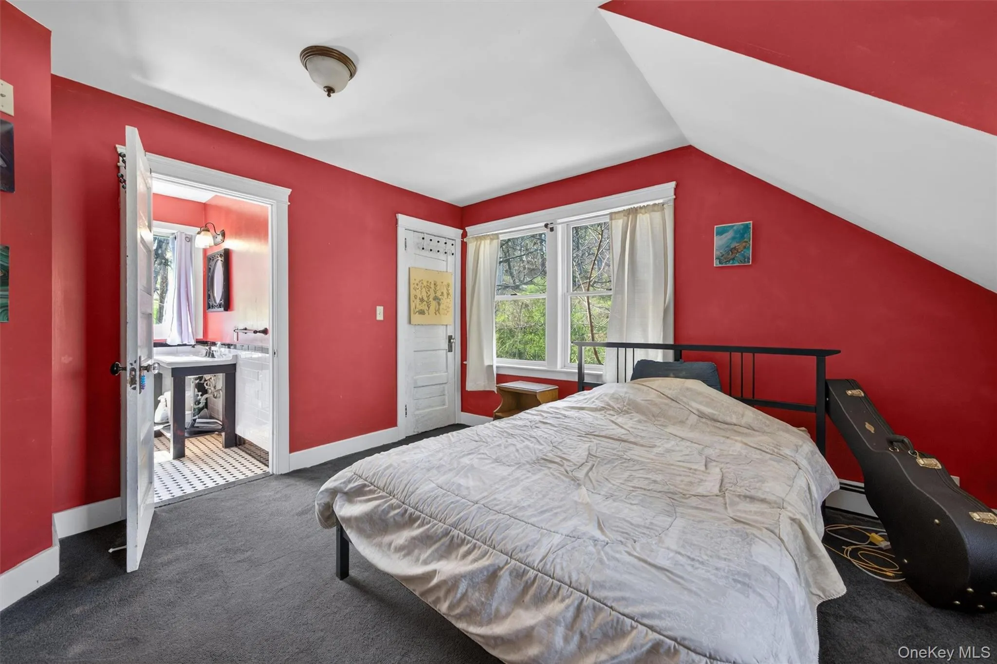 Primary bedroom with walk-in closet and en-suite bathroom Primary bedroom with walk-in closet and en-suite bathroom