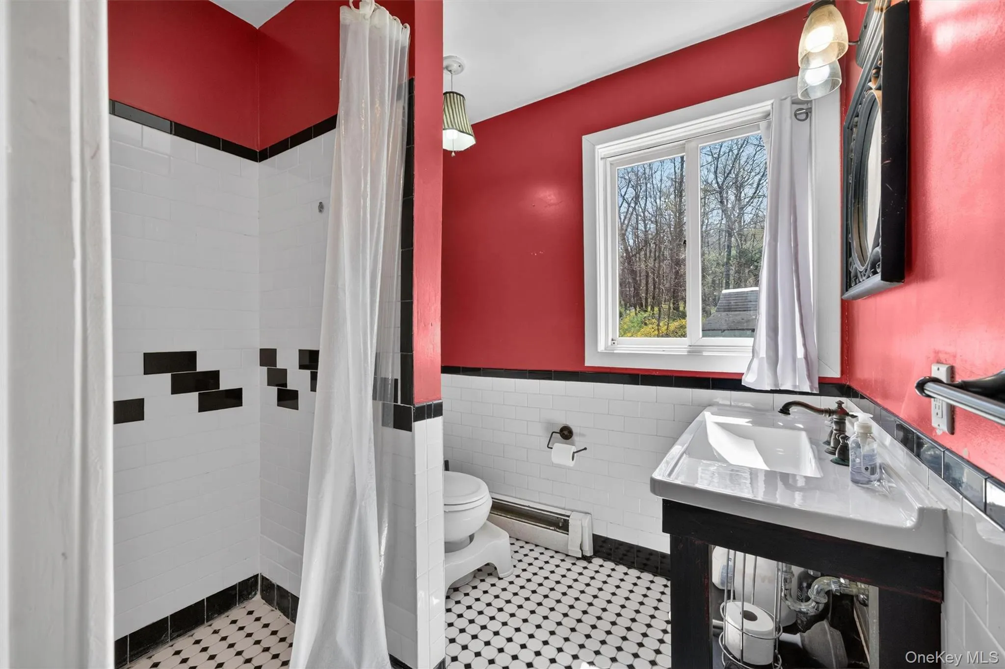 Primary bathroom with classic black and white tiles and custom oversized shower stall Primary bathroom with classic black and white tiles and custom oversized shower stall