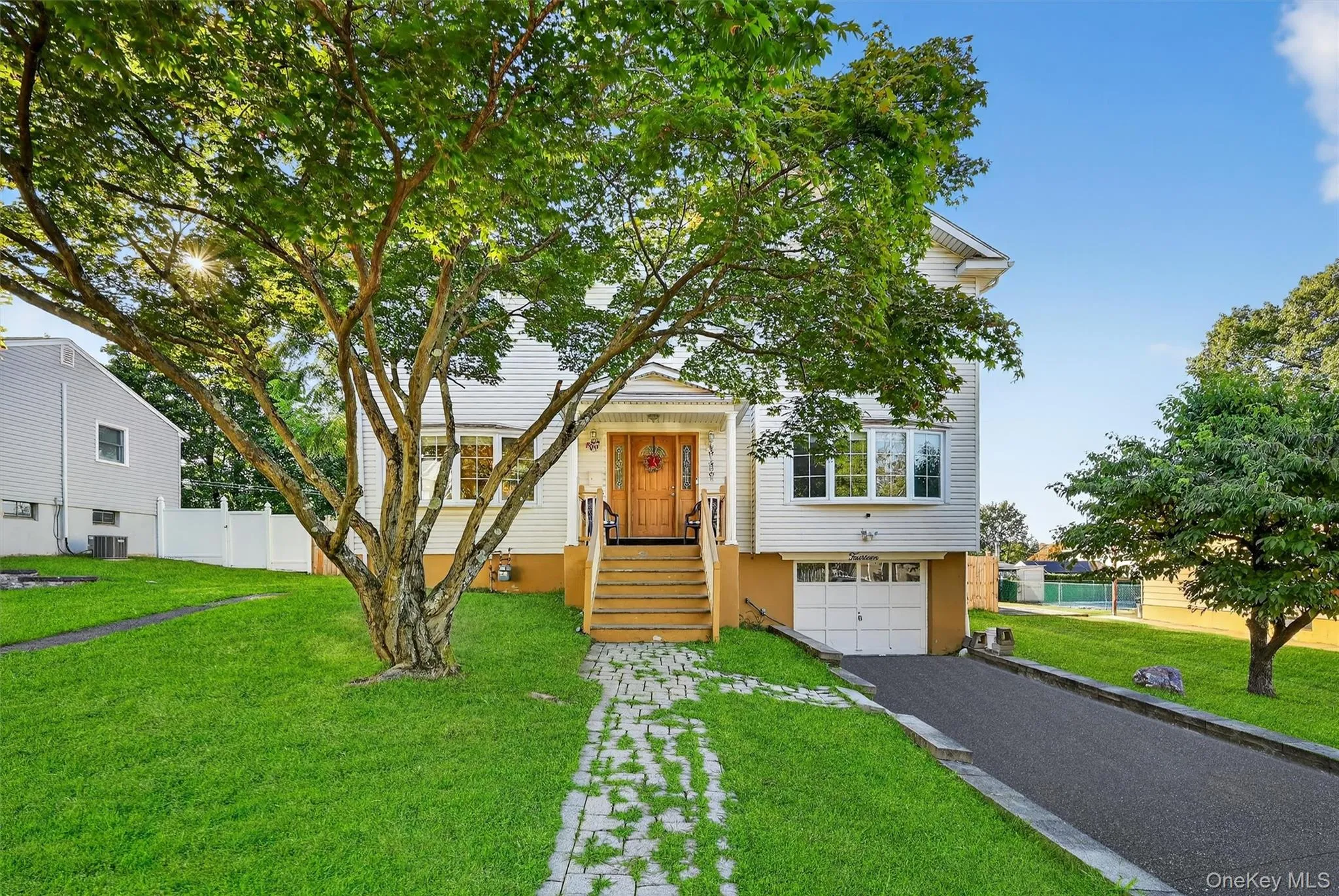 View of front of house featuring driveway and a garage View of front of house featuring driveway and a garage
