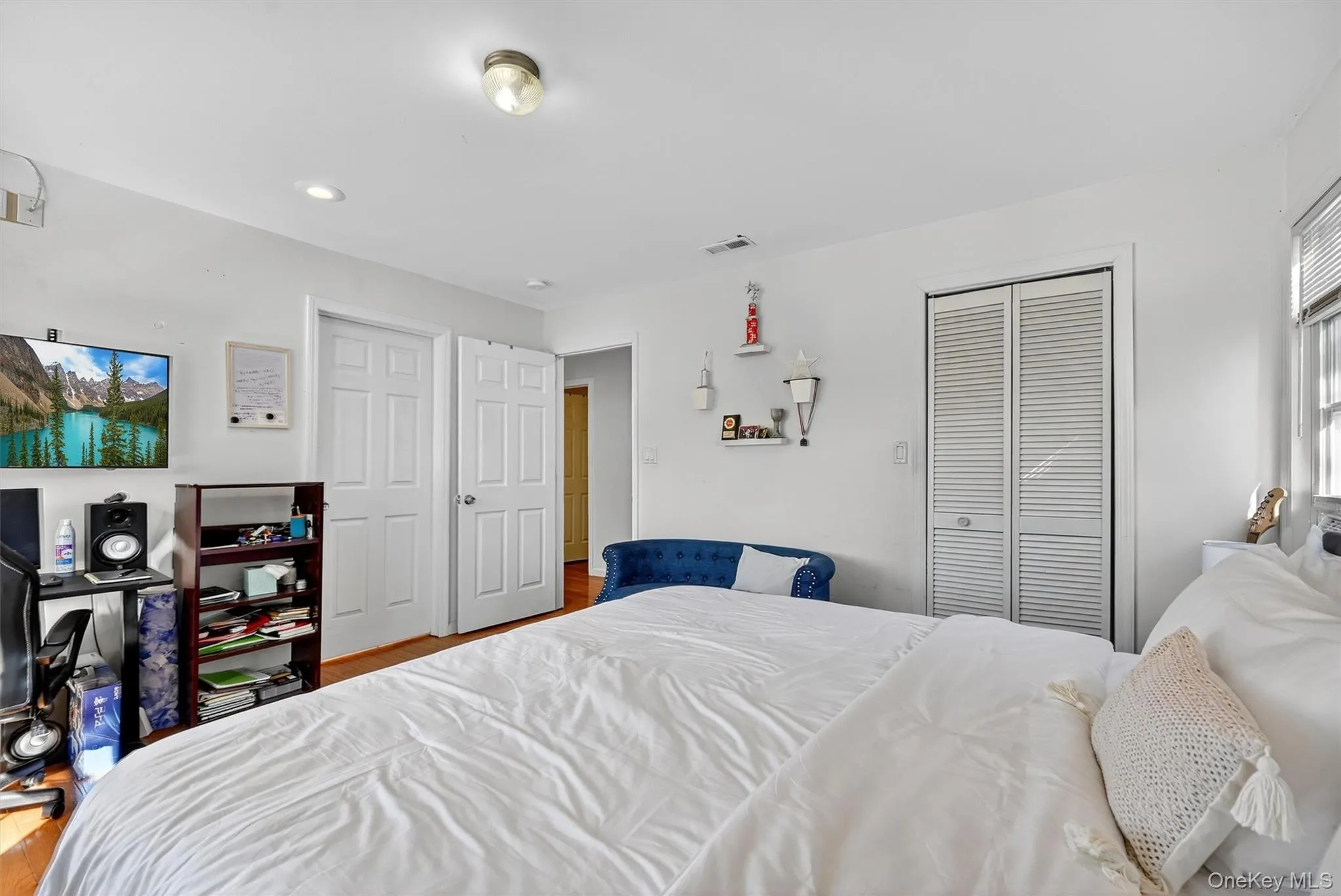 Bedroom featuring wood finished floors Bedroom featuring wood finished floors