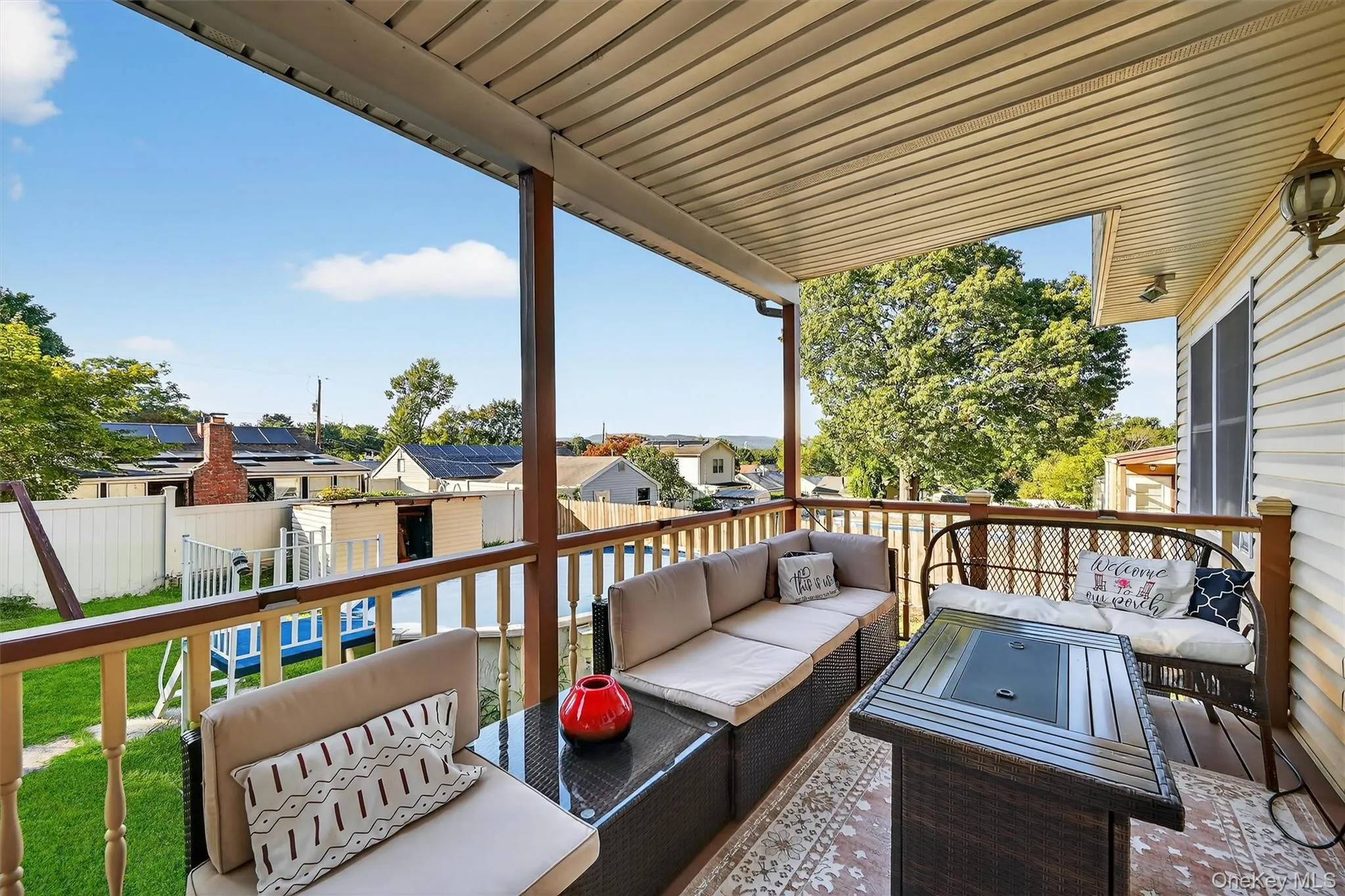 Deck featuring a residential view, a shed, an outdoor hangout area, and a fenced backyard Deck featuring a residential view, a shed, an outdoor hangout area, and a fenced backyard