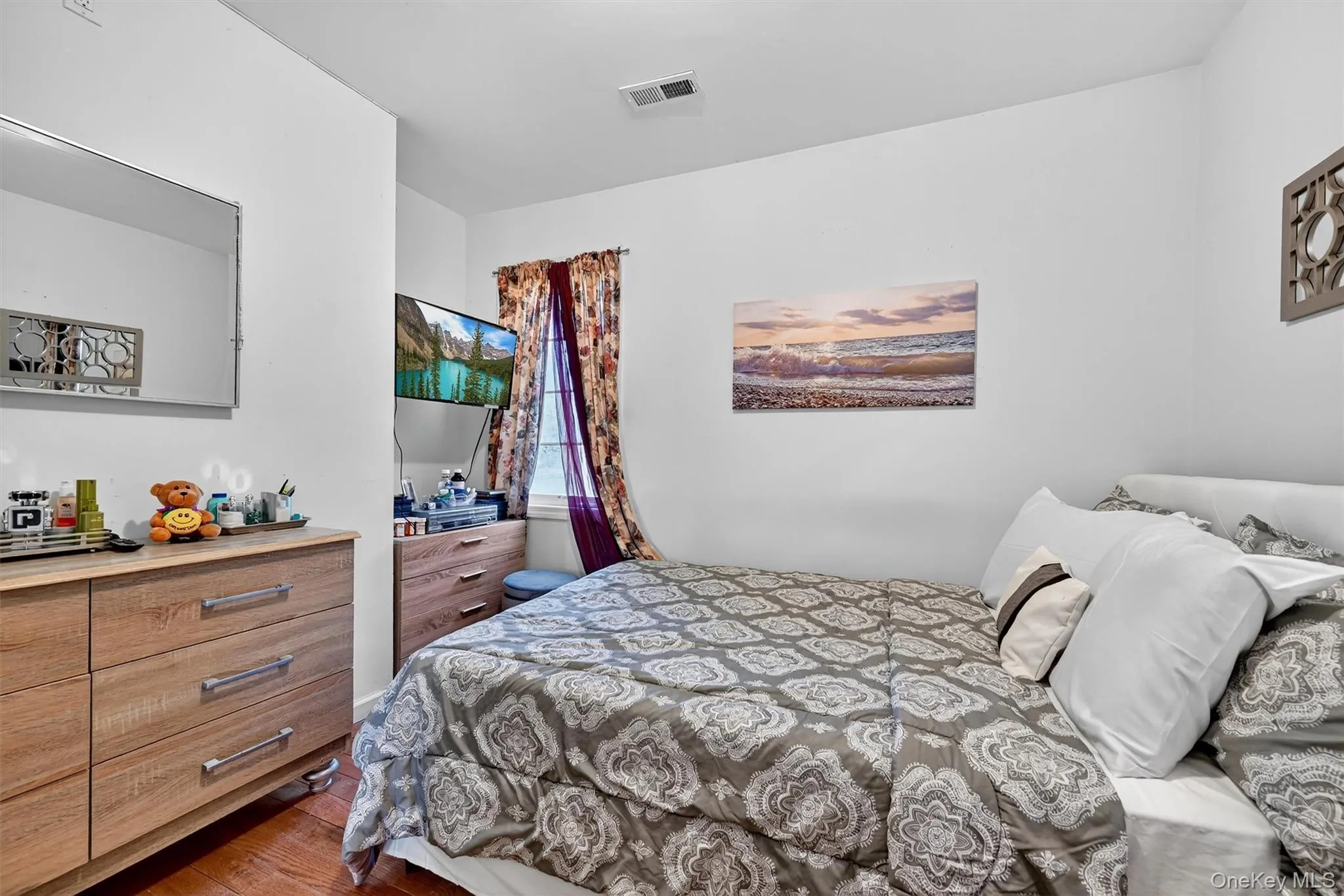 Bedroom with dark wood-type flooring Bedroom with dark wood-type flooring