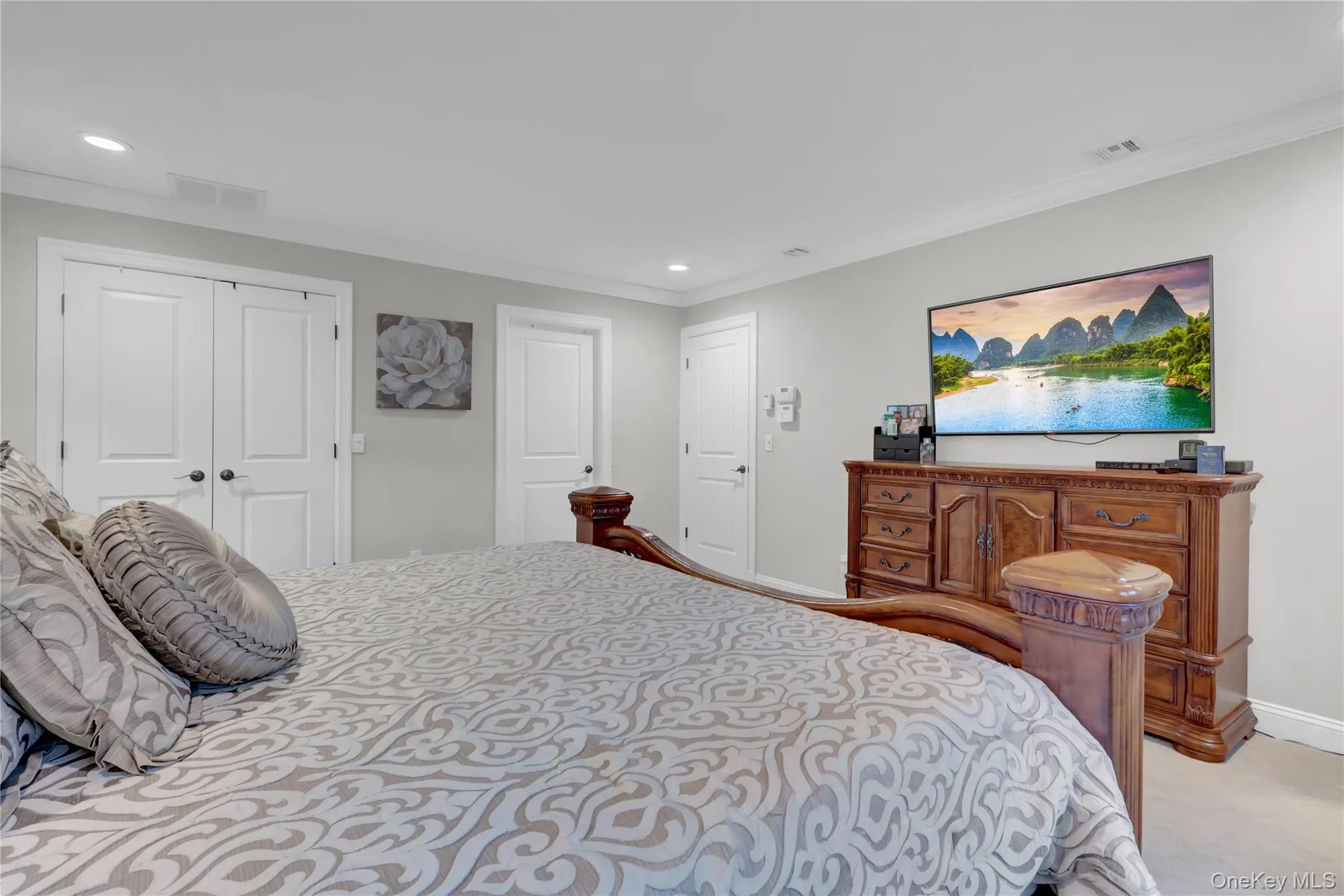 Room featuring recessed lighting, light gray wall paint, and white trim molding Room featuring recessed lighting, light gray wall paint, and white trim molding