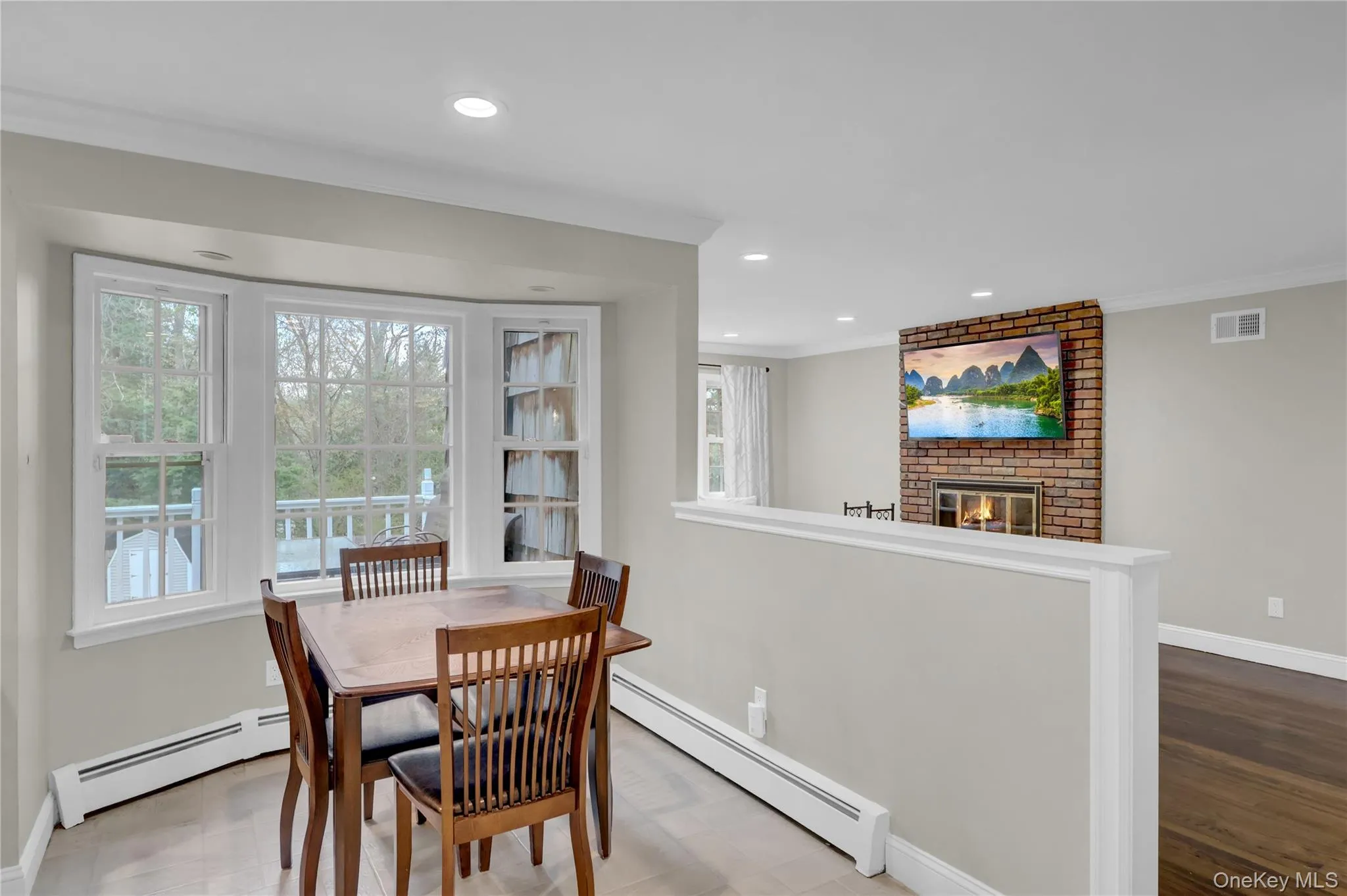 Dining area with bay window and recessed lighting Dining area with bay window and recessed lighting