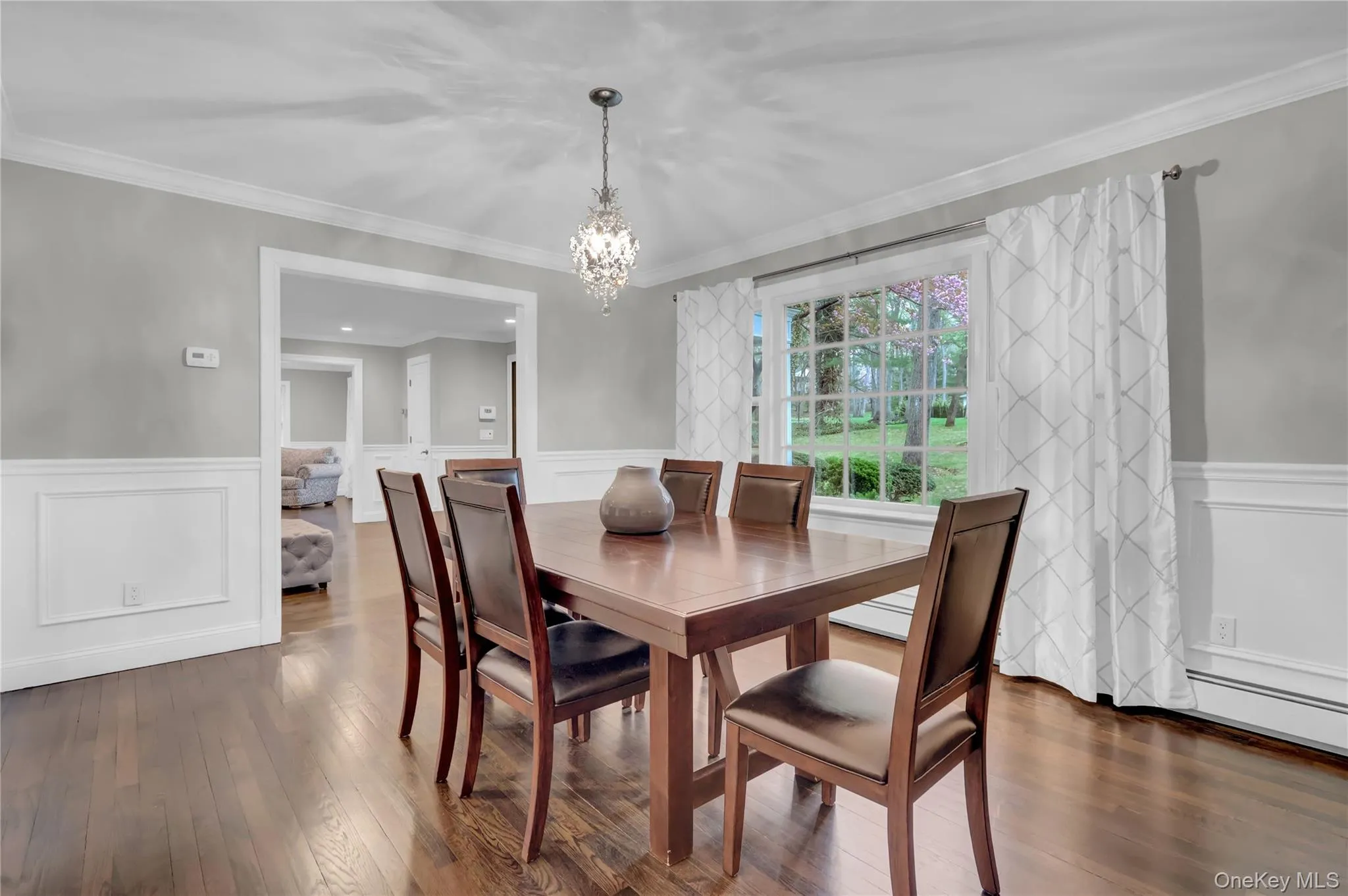 Formal dining area with rich wood-finish flooring Formal dining area with rich wood-finish flooring