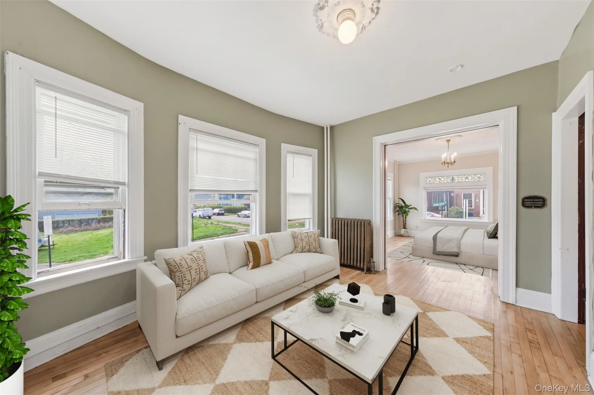Virtually staged. Bright living space with oversized windows and sightlines into additional rooms. Virtually staged. Bright living space with oversized windows and sightlines into additional rooms.