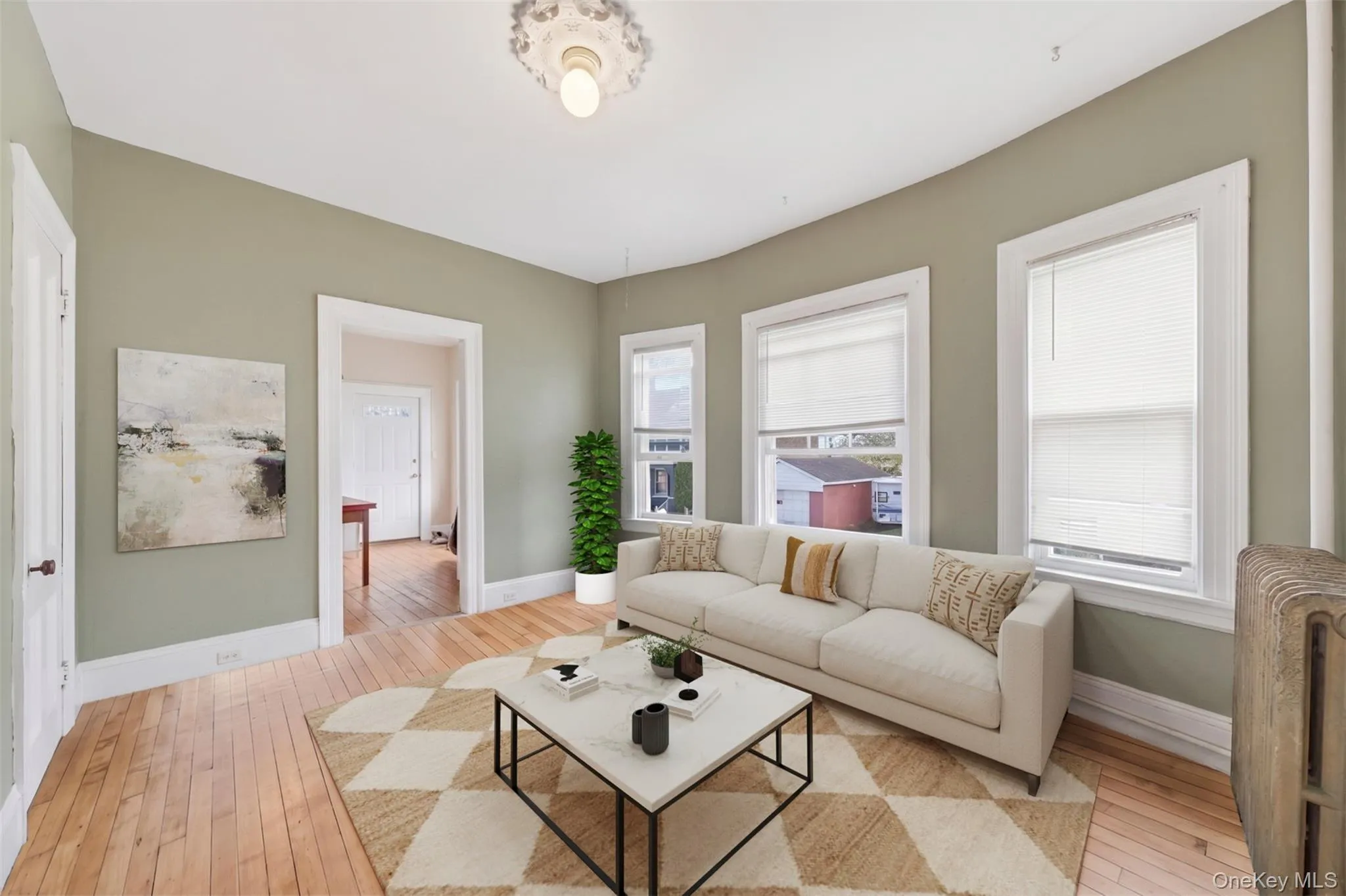 Virtually staged. Spacious living area with classic charm, tall ceilings, and a functional layout. Virtually staged. Spacious living area with classic charm, tall ceilings, and a functional layout.
