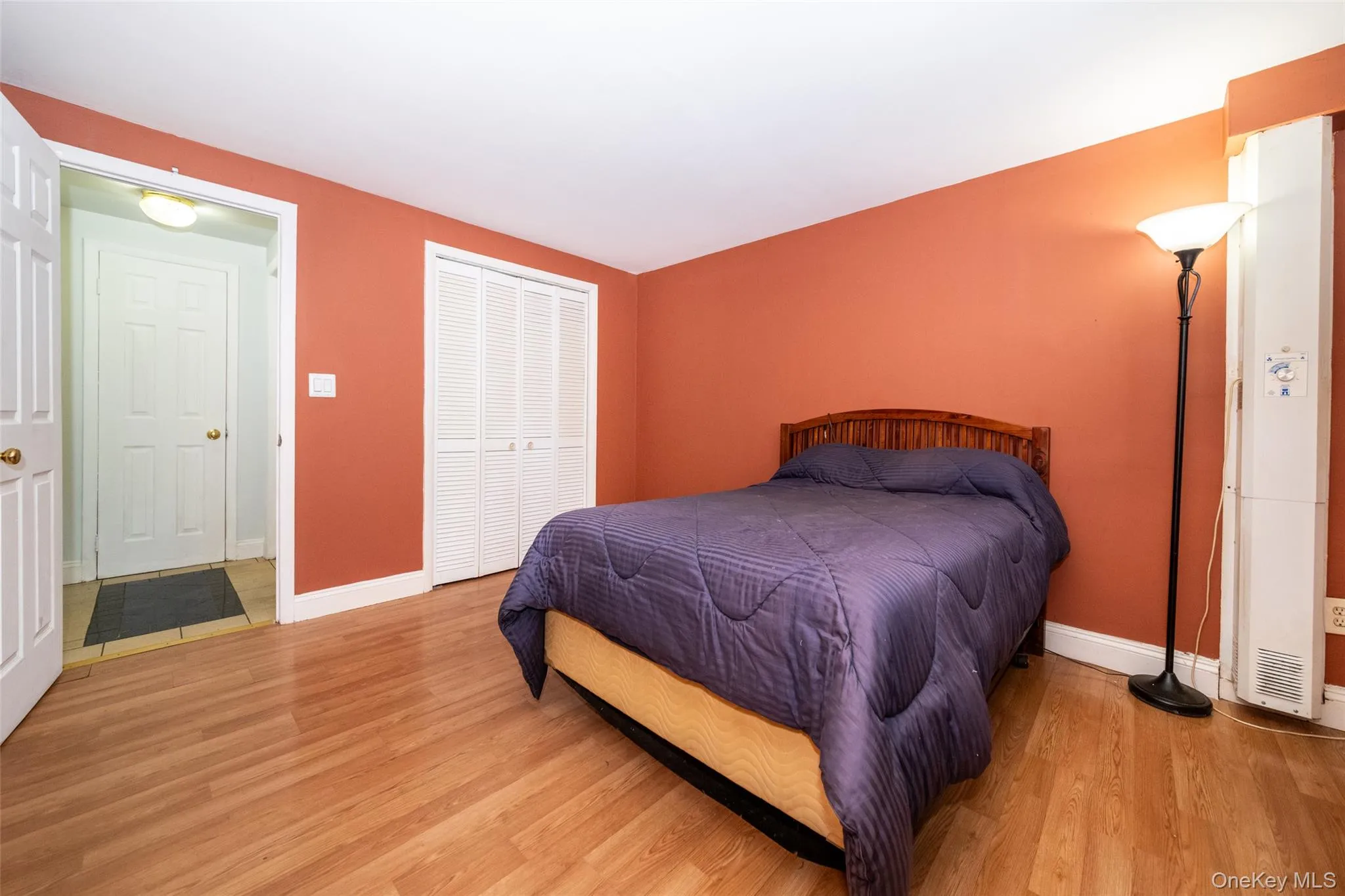 Large Bedroom with hardwood floors and large double closet Large Bedroom with hardwood floors and large double closet