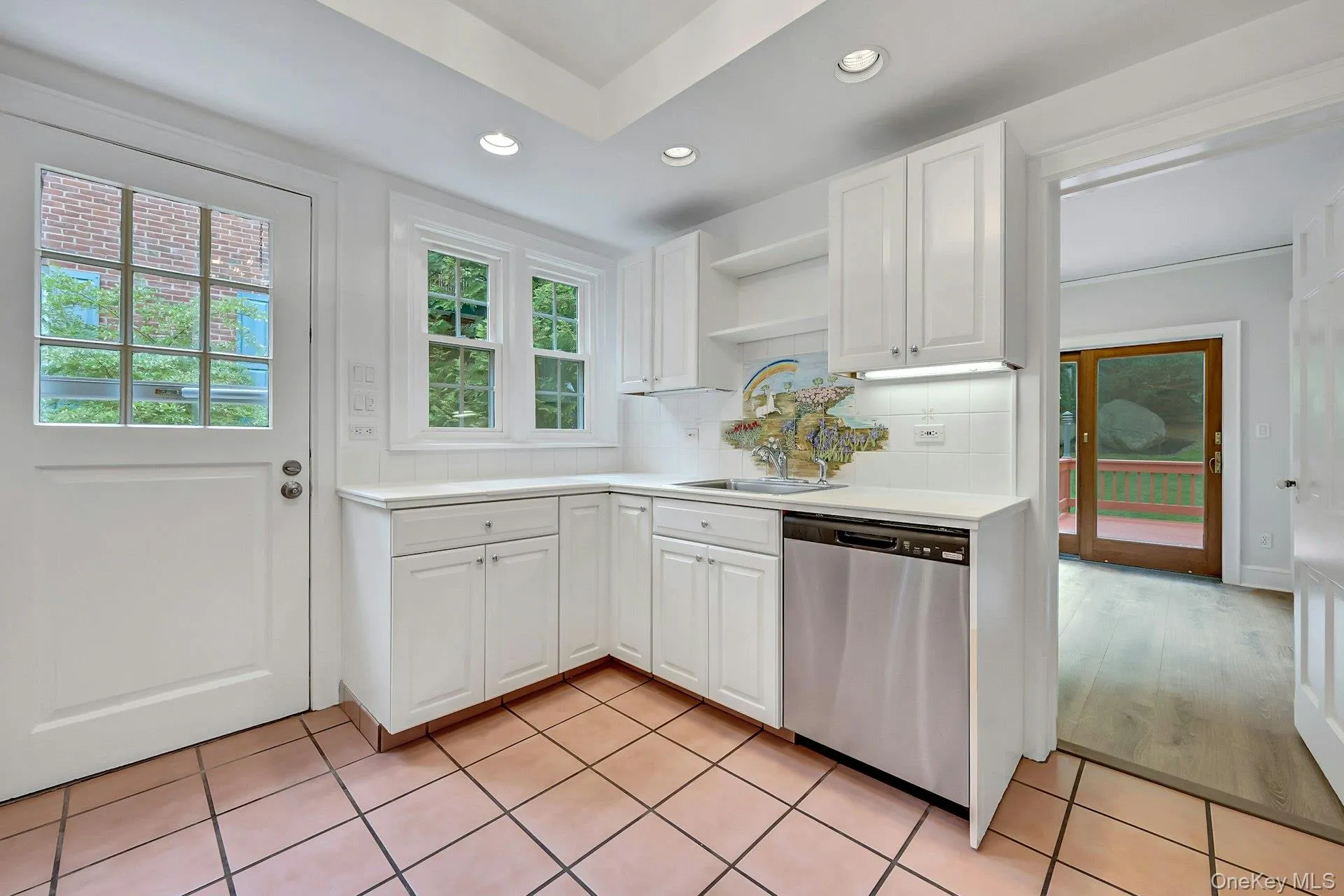 Kitchen with efficient workspace and sightline to breakfast room Kitchen with efficient workspace and sightline to breakfast room