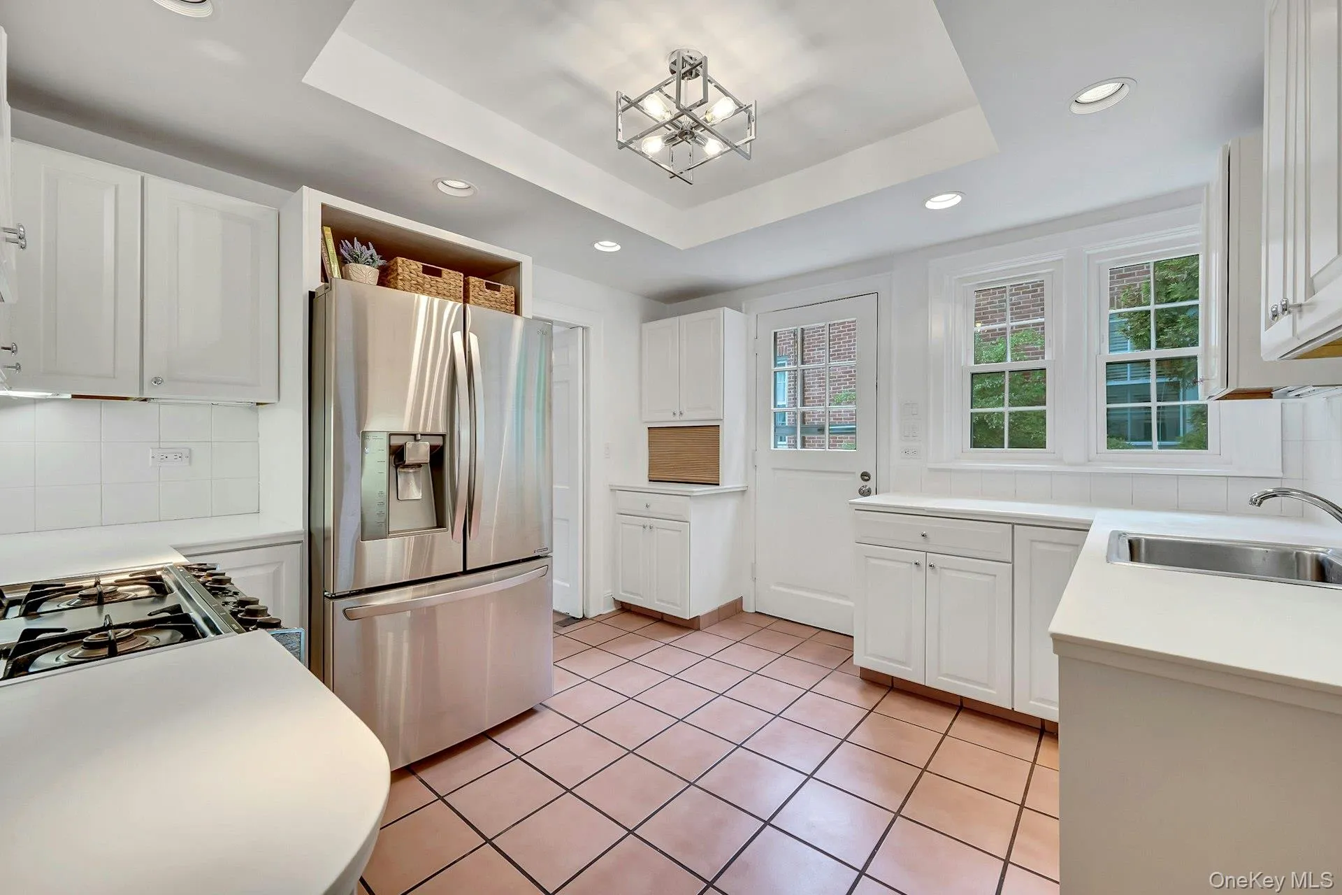 Kitchen with traditional swinging doors to formal dining room Kitchen with traditional swinging doors to formal dining room
