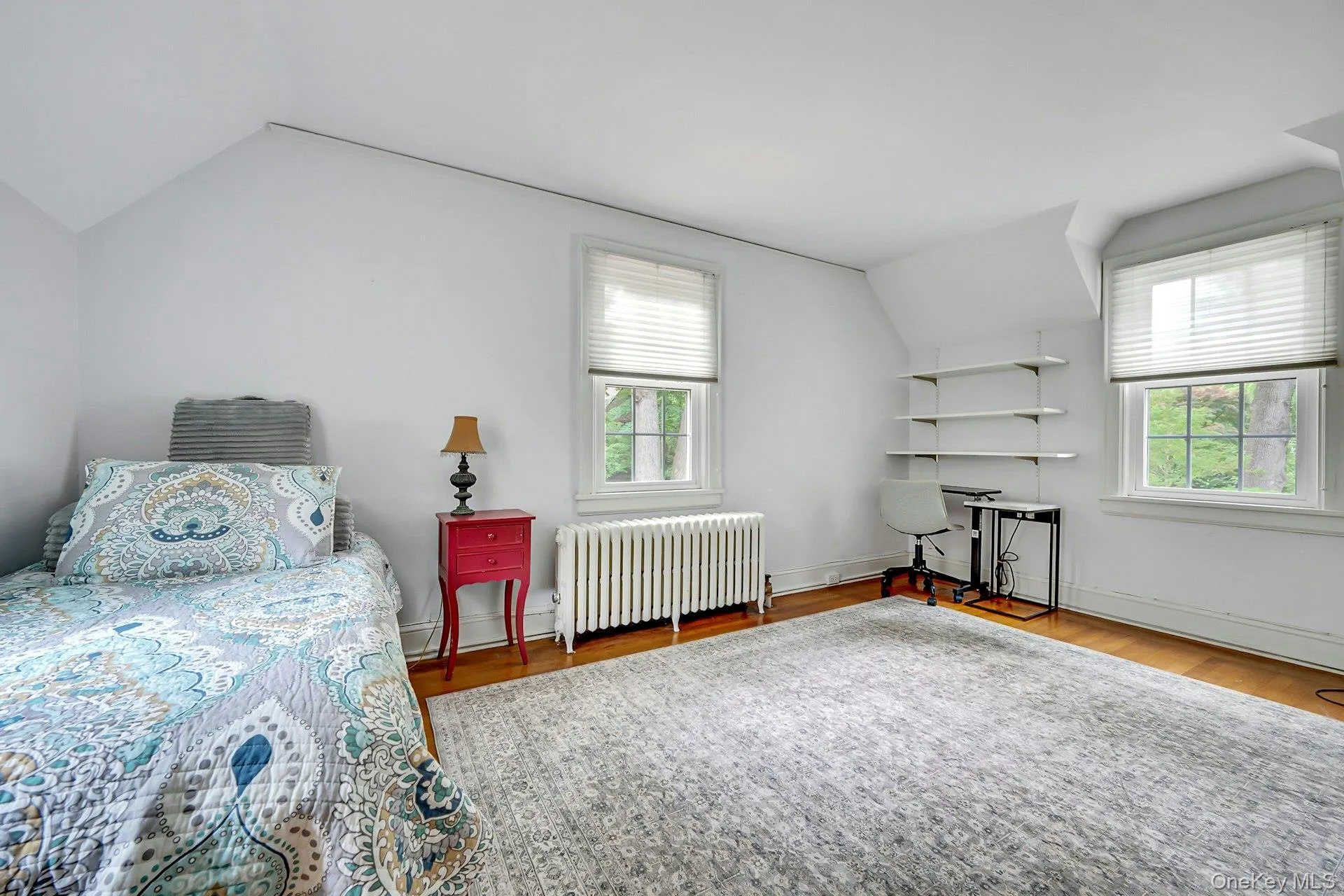Rear bedroom with windows on three sides and abundant natural light Rear bedroom with windows on three sides and abundant natural light