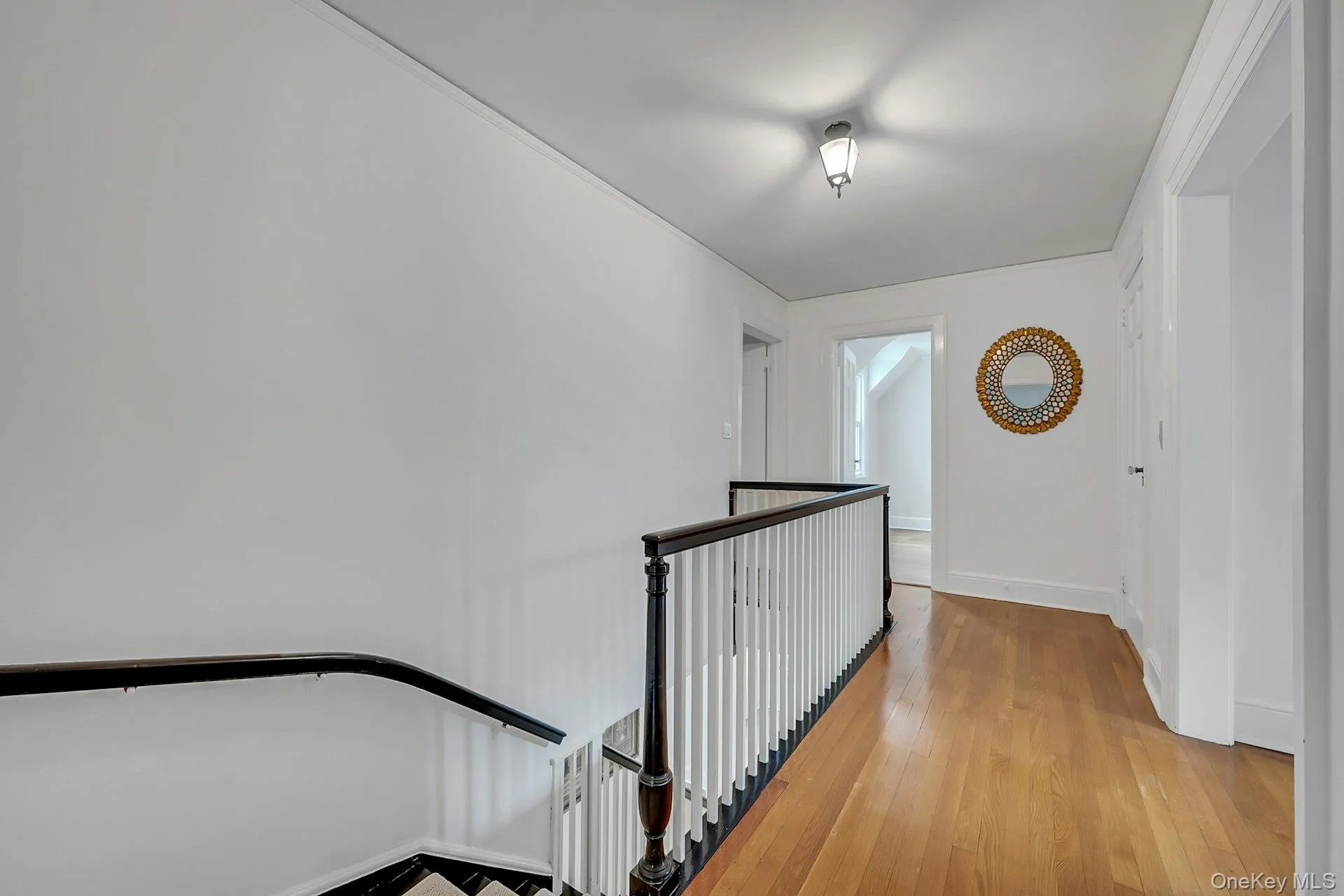 Upstairs hallway with front-facing natural light Upstairs hallway with front-facing natural light