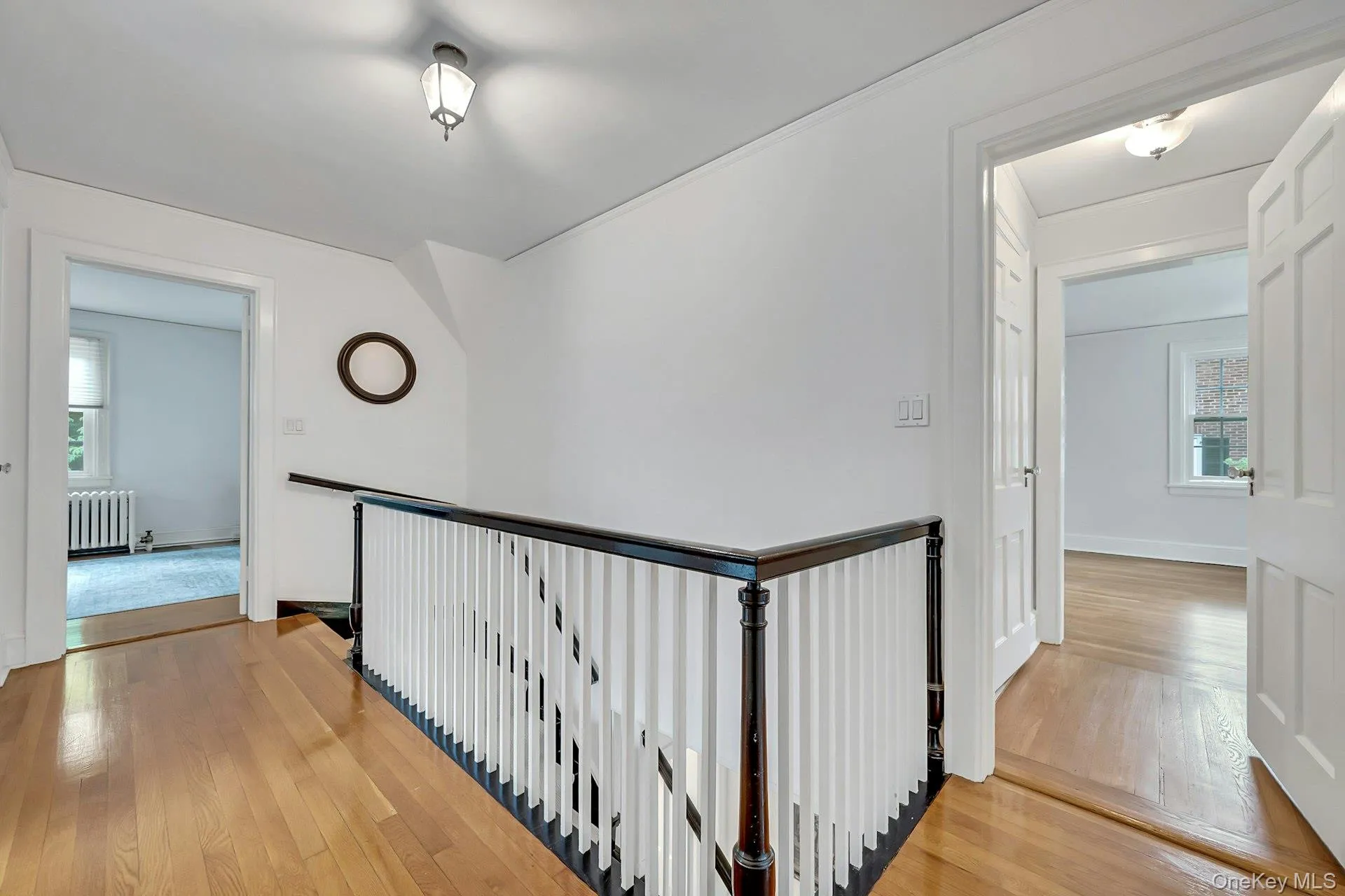Upstairs hallway with access to bedrooms and rear exposure Upstairs hallway with access to bedrooms and rear exposure
