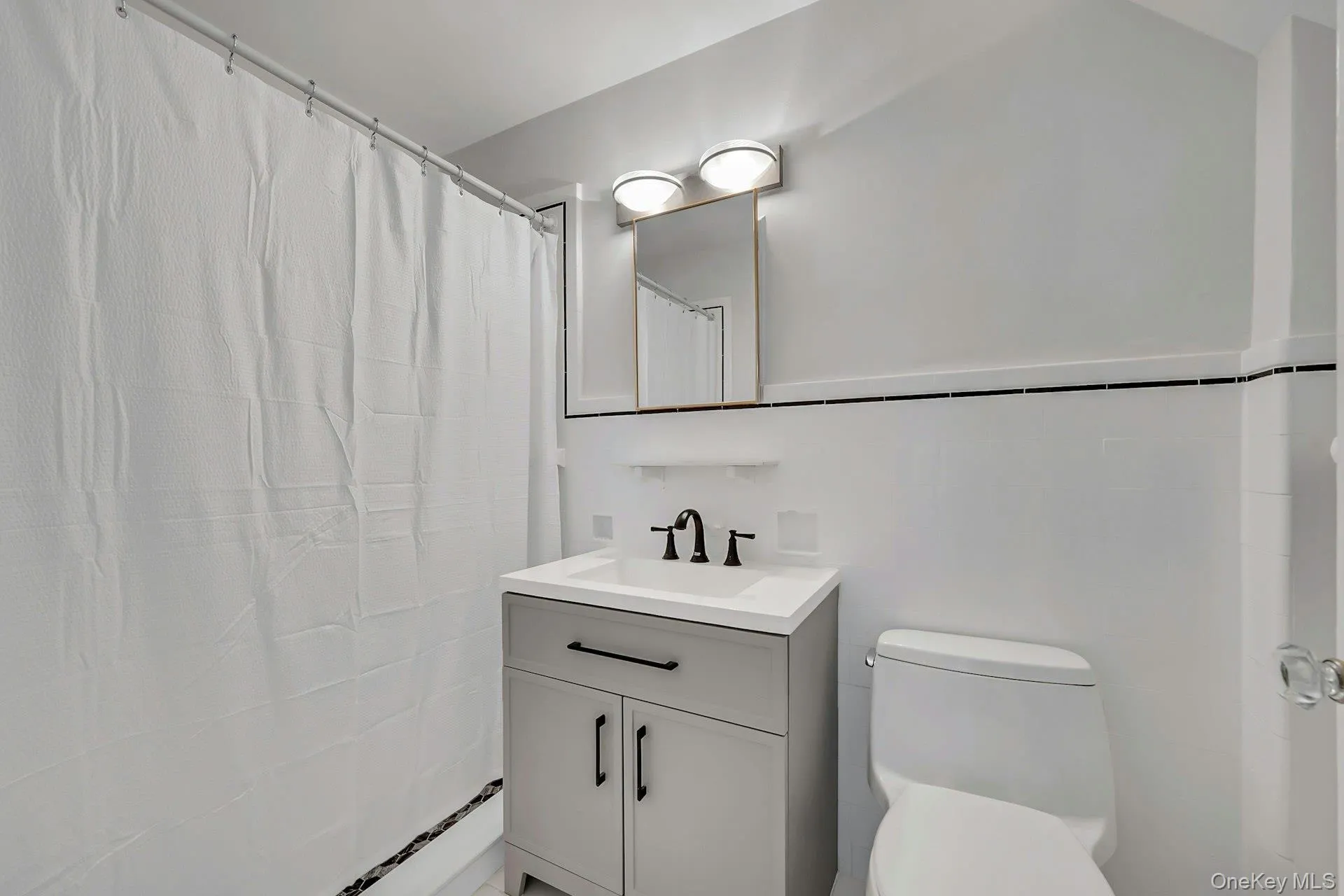 Updated primary en-suite bathroom with shower Updated primary en-suite bathroom with shower