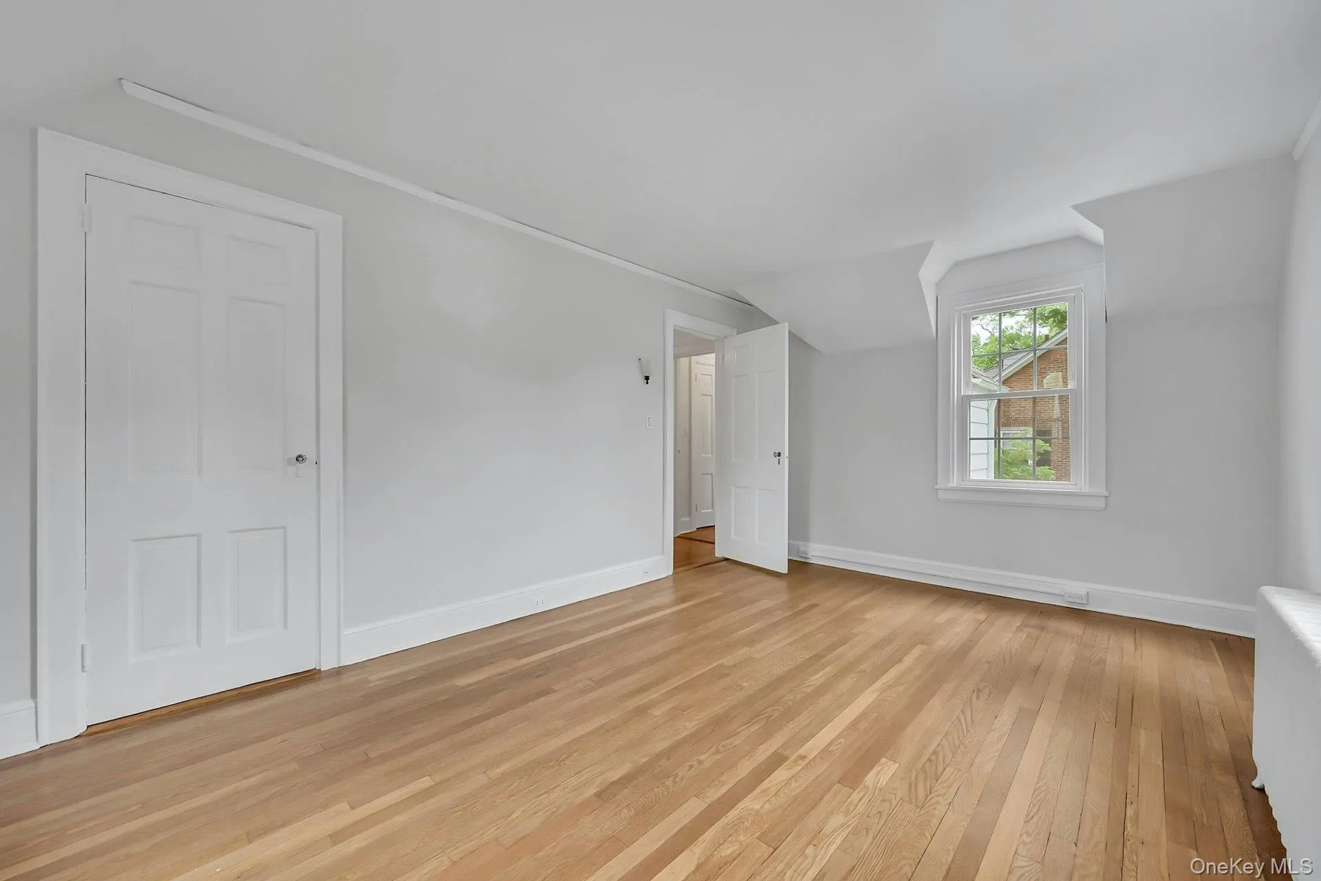 Front bedroom with three exposures and ample closet space Front bedroom with three exposures and ample closet space