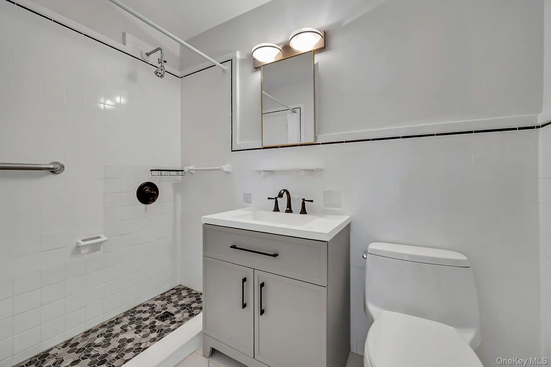 Updated primary en-suite bathroom with shower Updated primary en-suite bathroom with shower