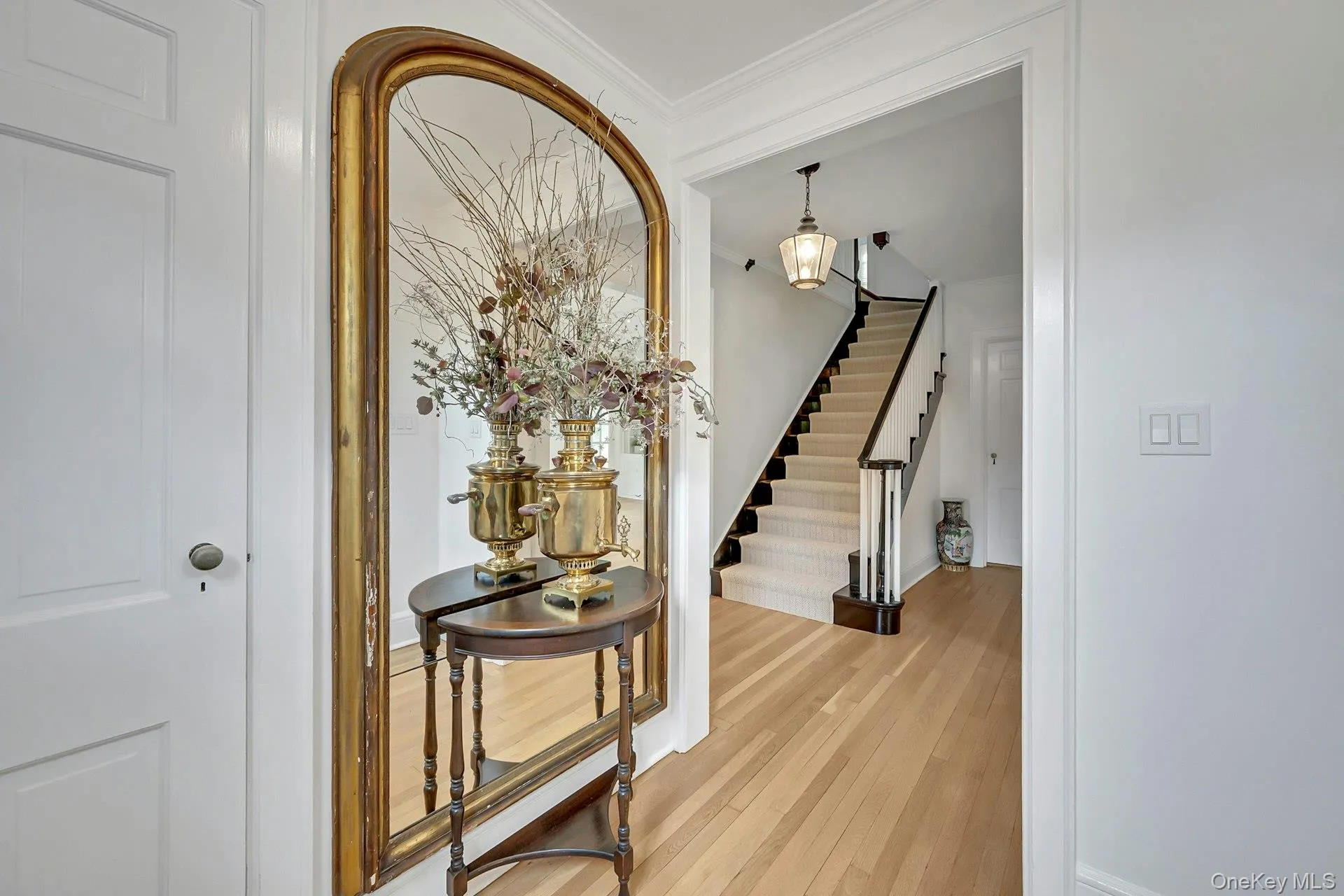 Elegant center hall foyer with grand staircase Elegant center hall foyer with grand staircase