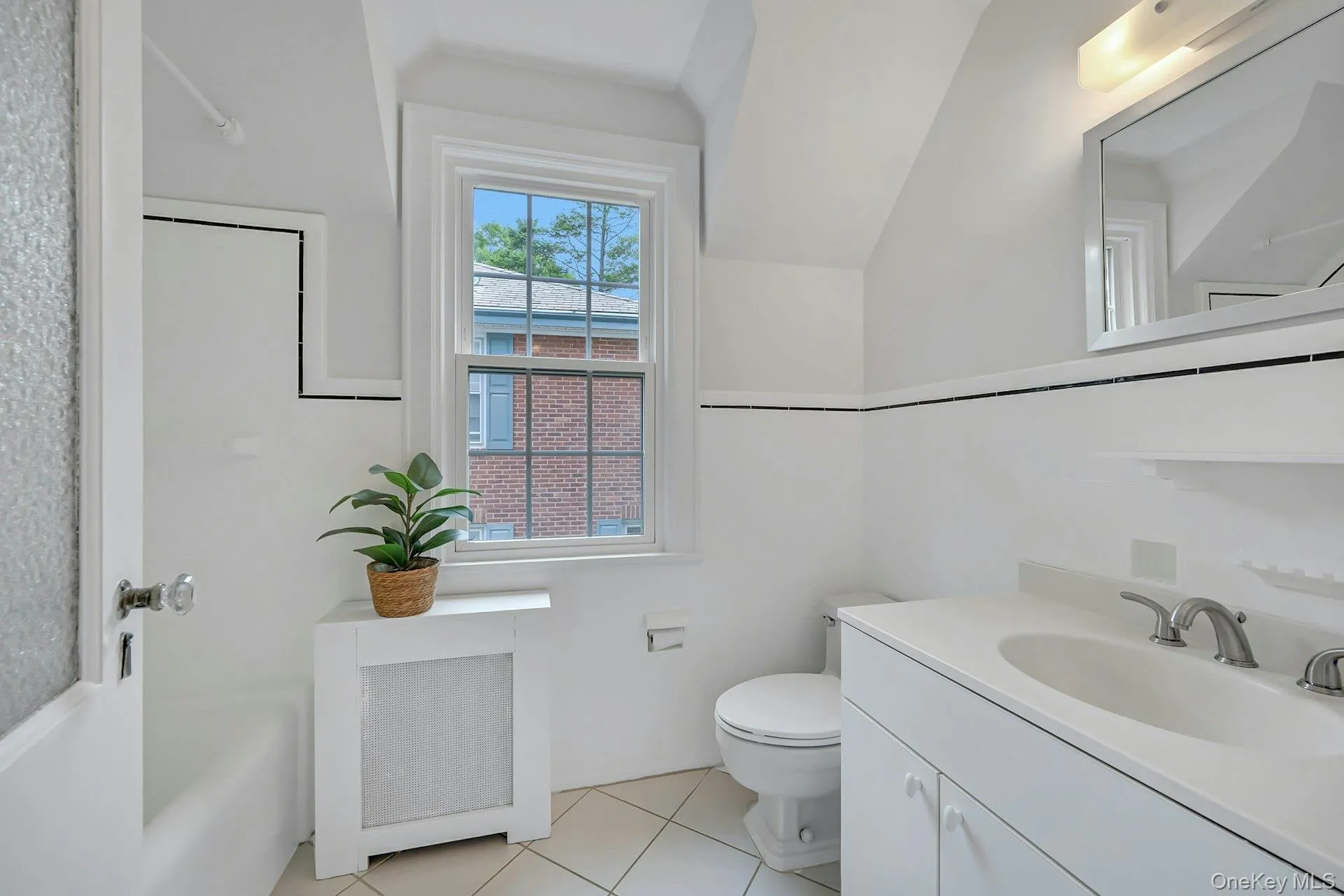 Clean and well-maintained upstairs hall bathroom with resurfaced tub Clean and well-maintained upstairs hall bathroom with resurfaced tub