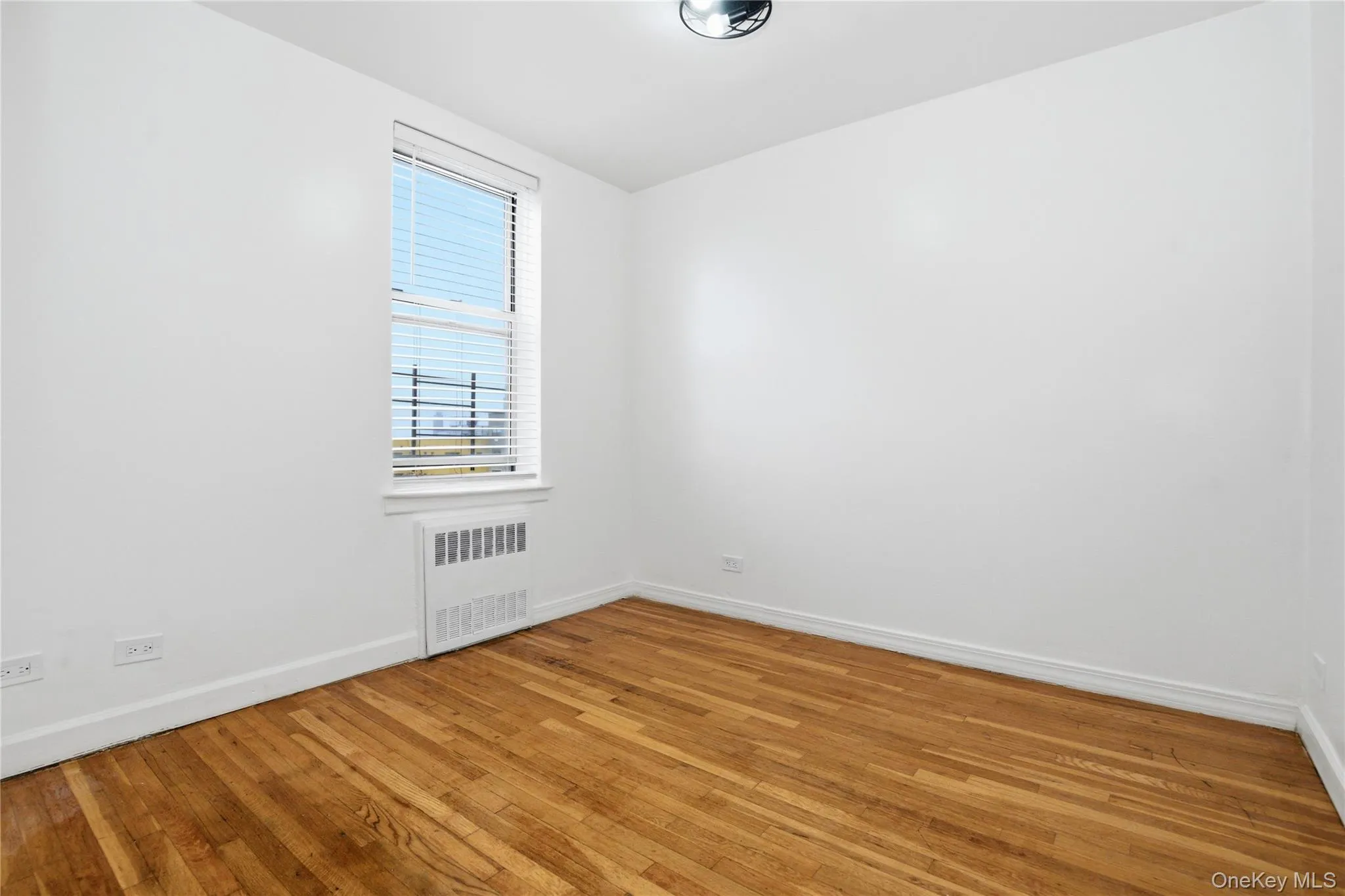 Sun drenched bedroom with freshly painted walls, double window and hardwood throughout Sun drenched bedroom with freshly painted walls, double window and hardwood throughout