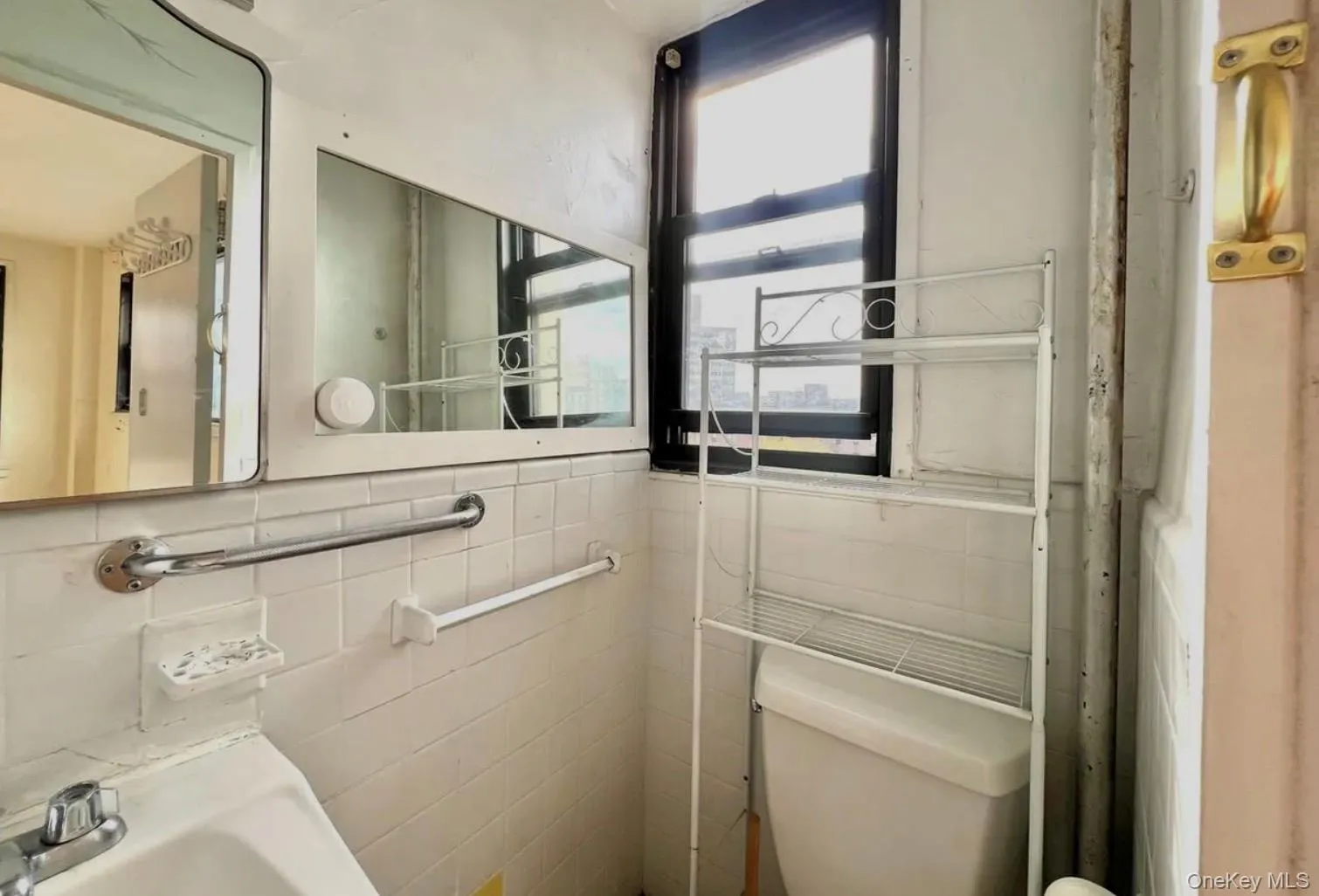Half bath featuring tile walls and toilet Half bath featuring tile walls and toilet