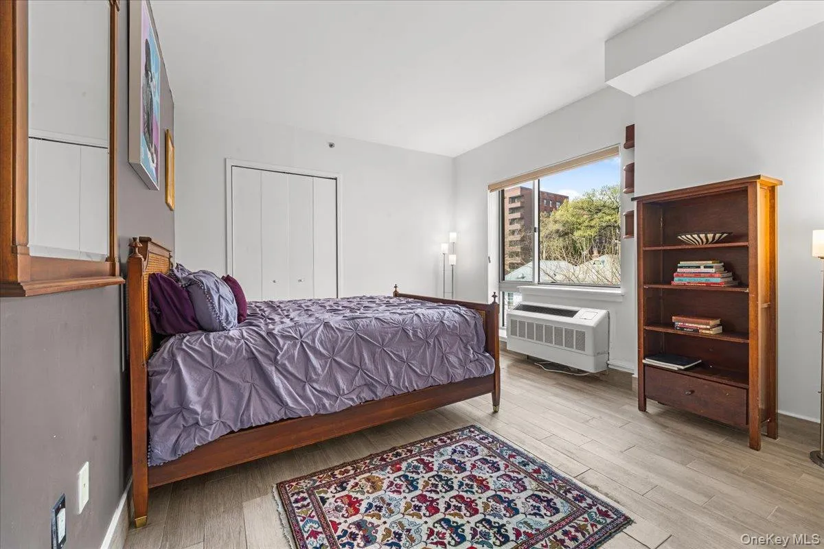 Windowed primary bedroom with walk-in closet and en-suite bath Windowed primary bedroom with walk-in closet and en-suite bath