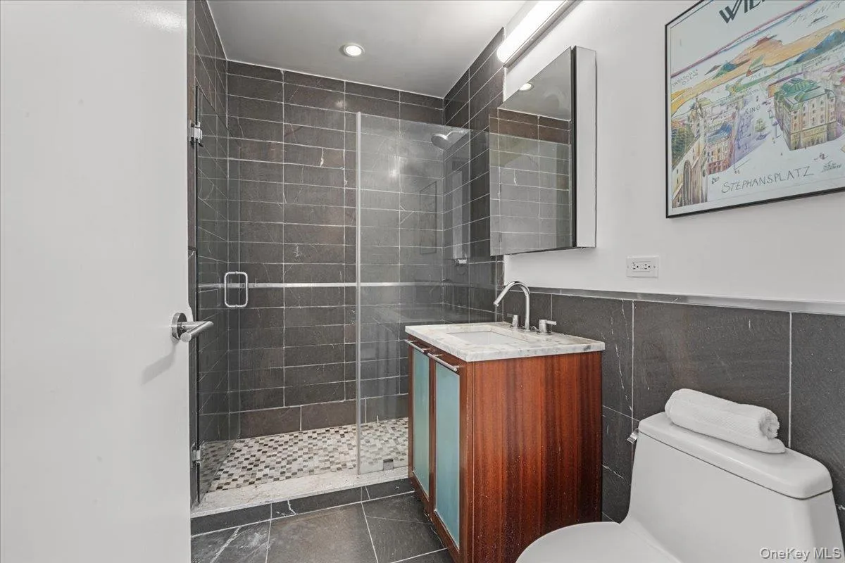Primary ensuite bath with rain shower fixture Primary ensuite bath with rain shower fixture