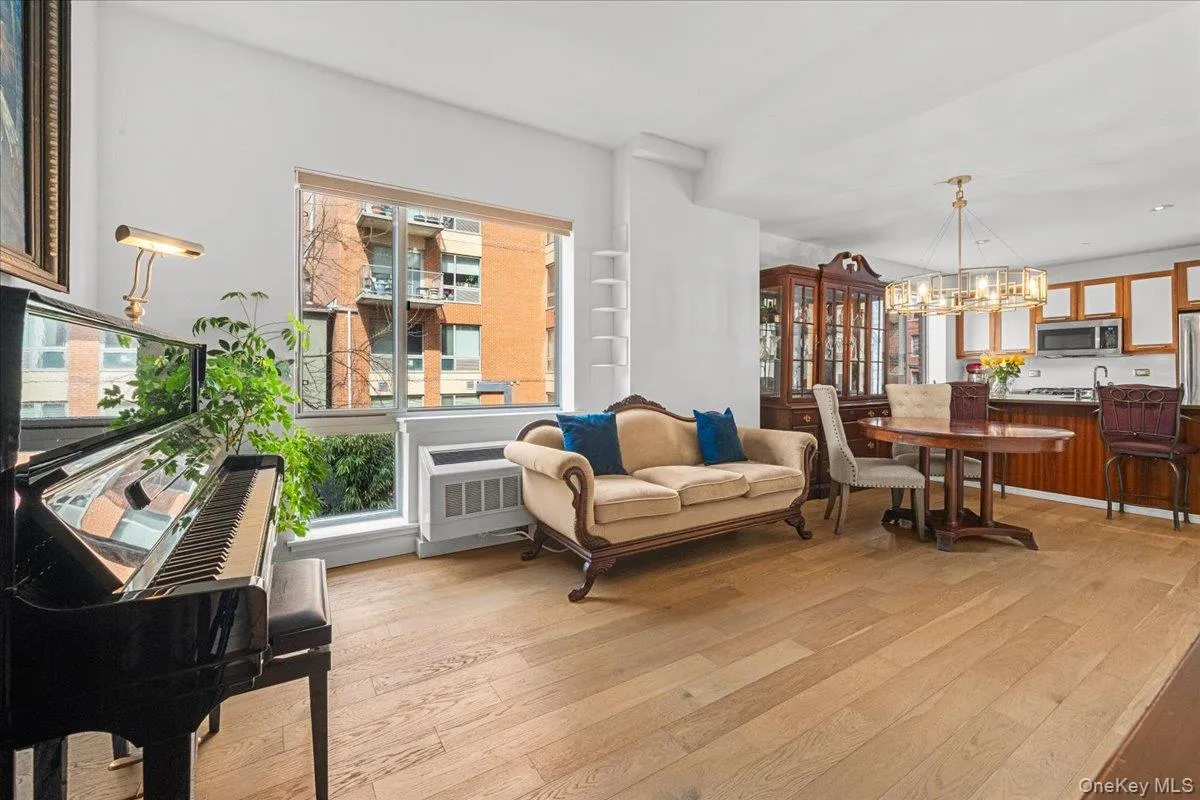 Open concept living dining areas with 2 tall floor to ceiling windows Open concept living dining areas with 2 tall floor to ceiling windows